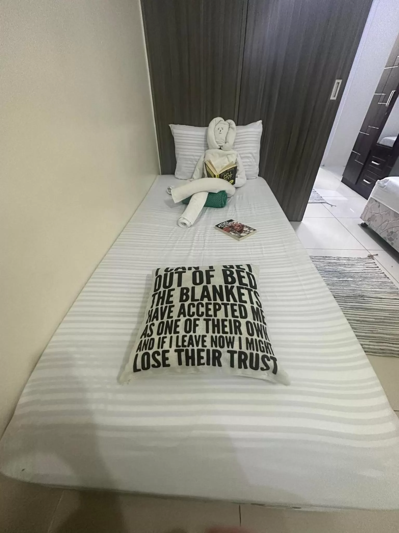 Bed in Green Residences Stays by PBYY