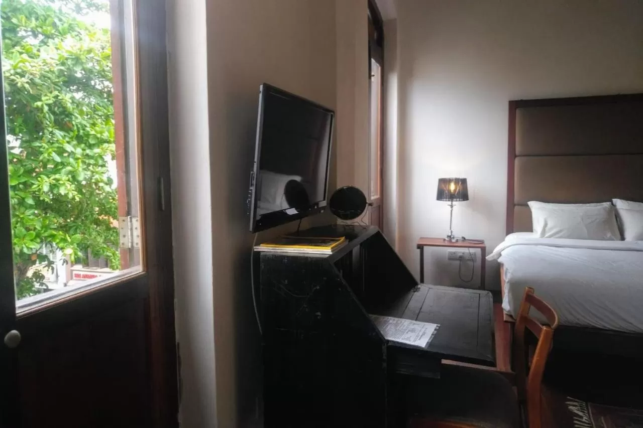 Bed in Ren I Tang Heritage Inn