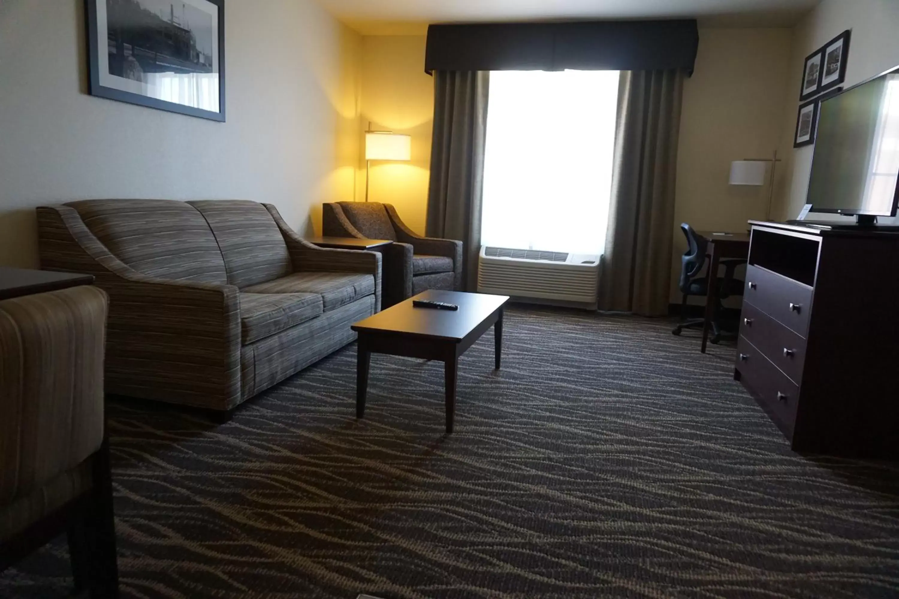Living room, Seating Area in Cobblestone Hotel & Suites - Chippewa Falls