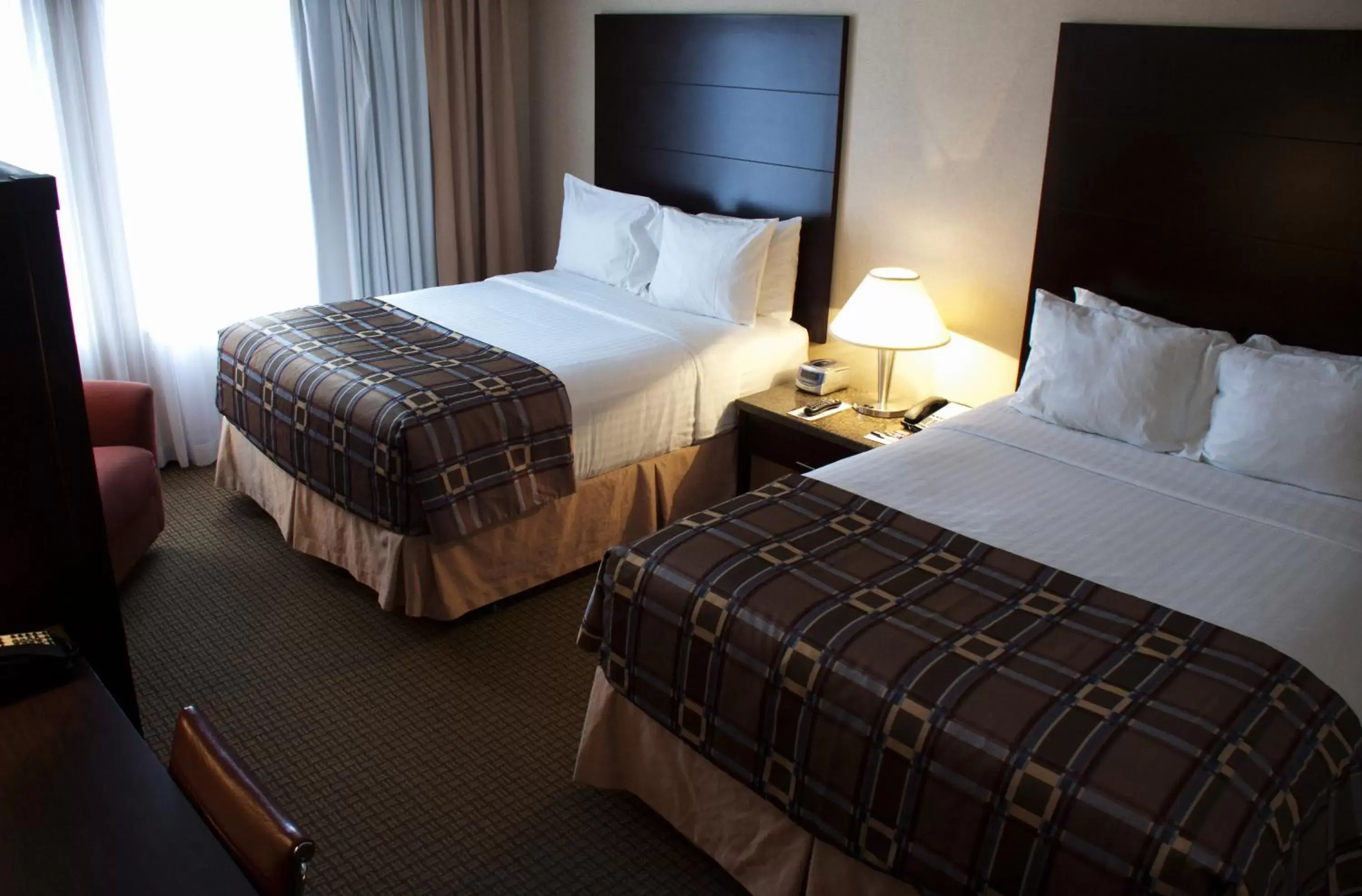 Photo of the whole room, Bed in Radisson Hotel & Suites Red Deer