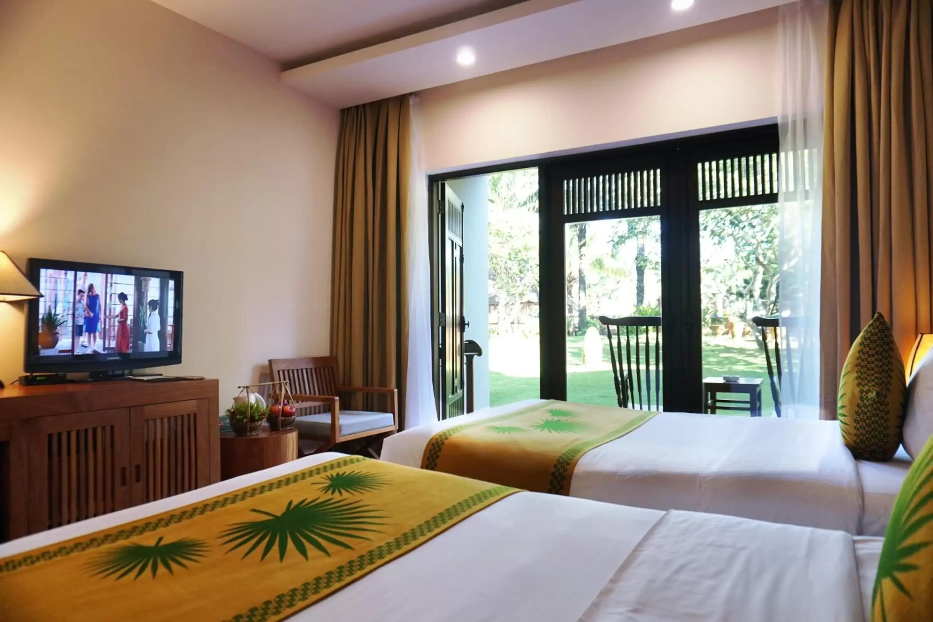 Garden view, Bed in Palm Garden Beach Resort & Spa