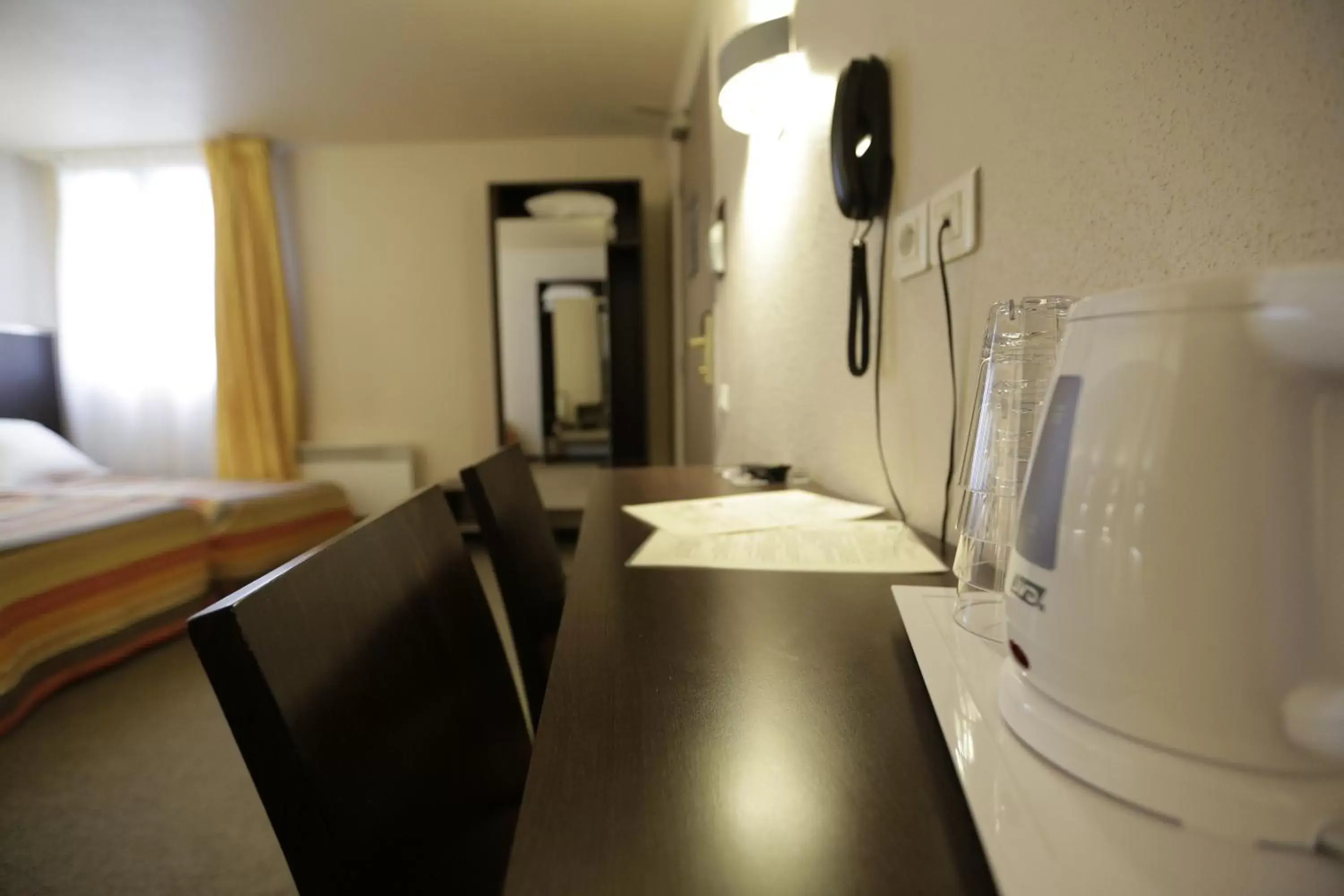 Bedroom, TV/Entertainment Center in Hôtel Au Petit Caporal