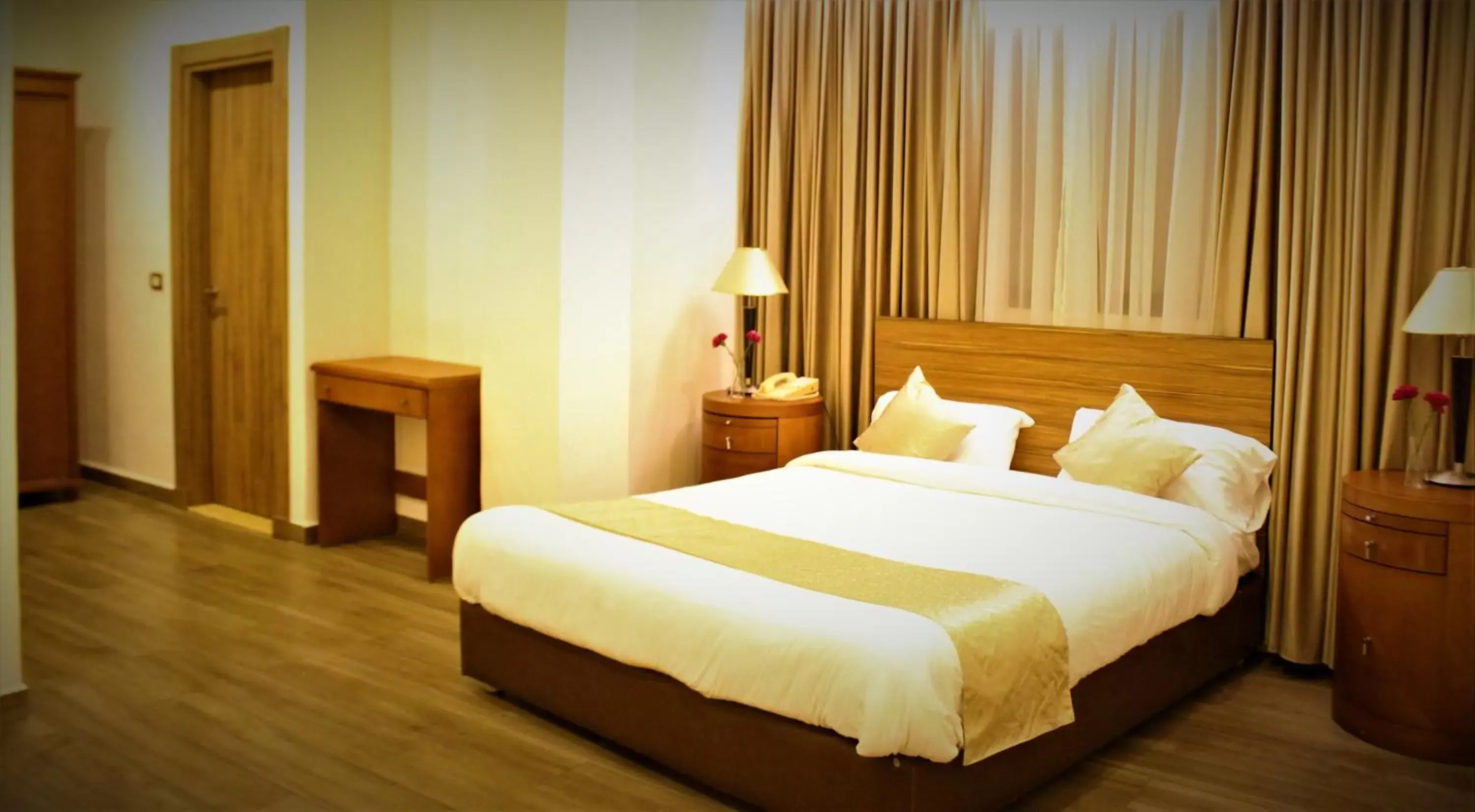 Bed in New MerryLand Hotel Bed in New MerryLand Hotel