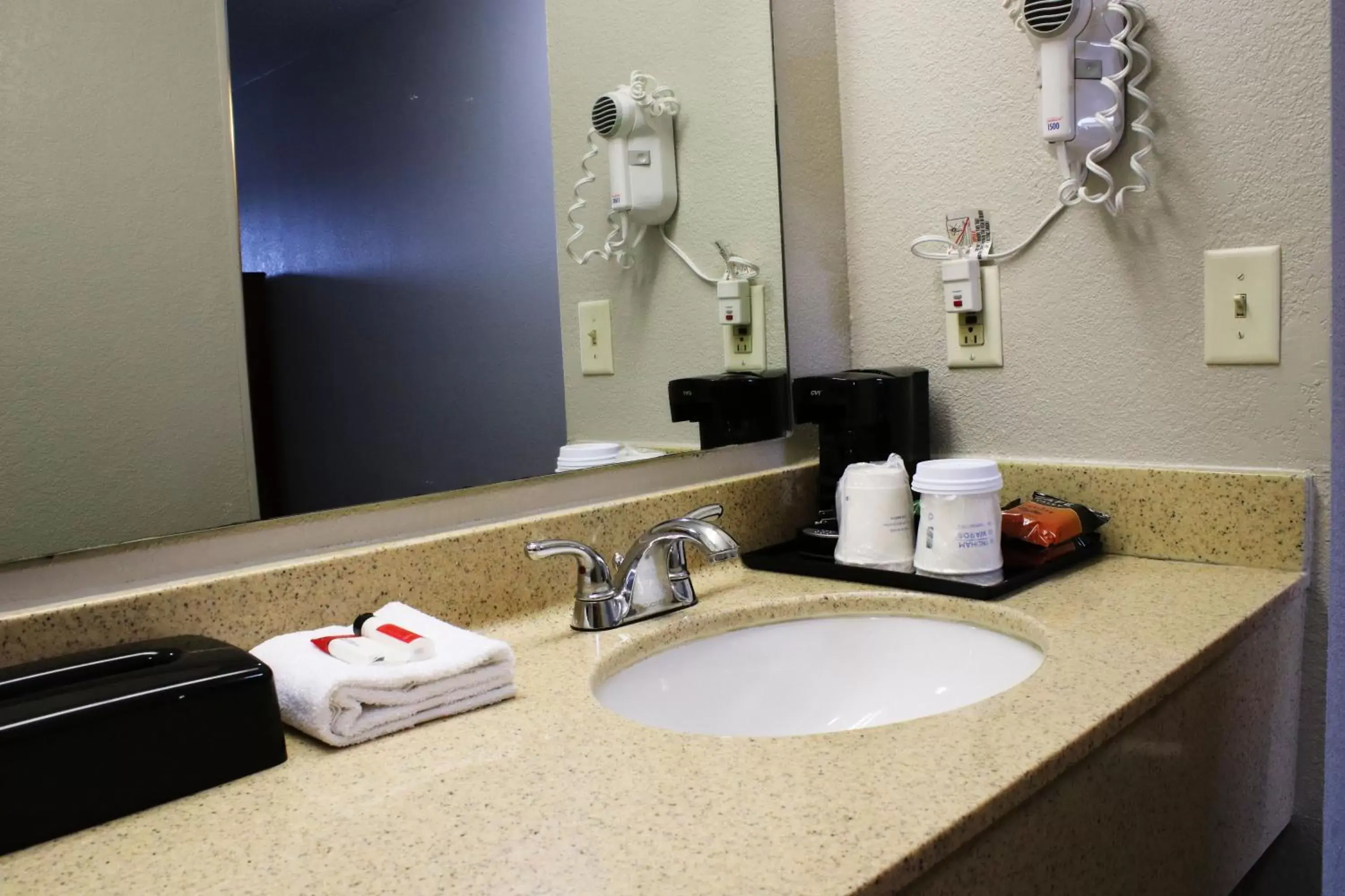 Bathroom in Days Inn & Suites by Wyndham Bloomington/Normal IL