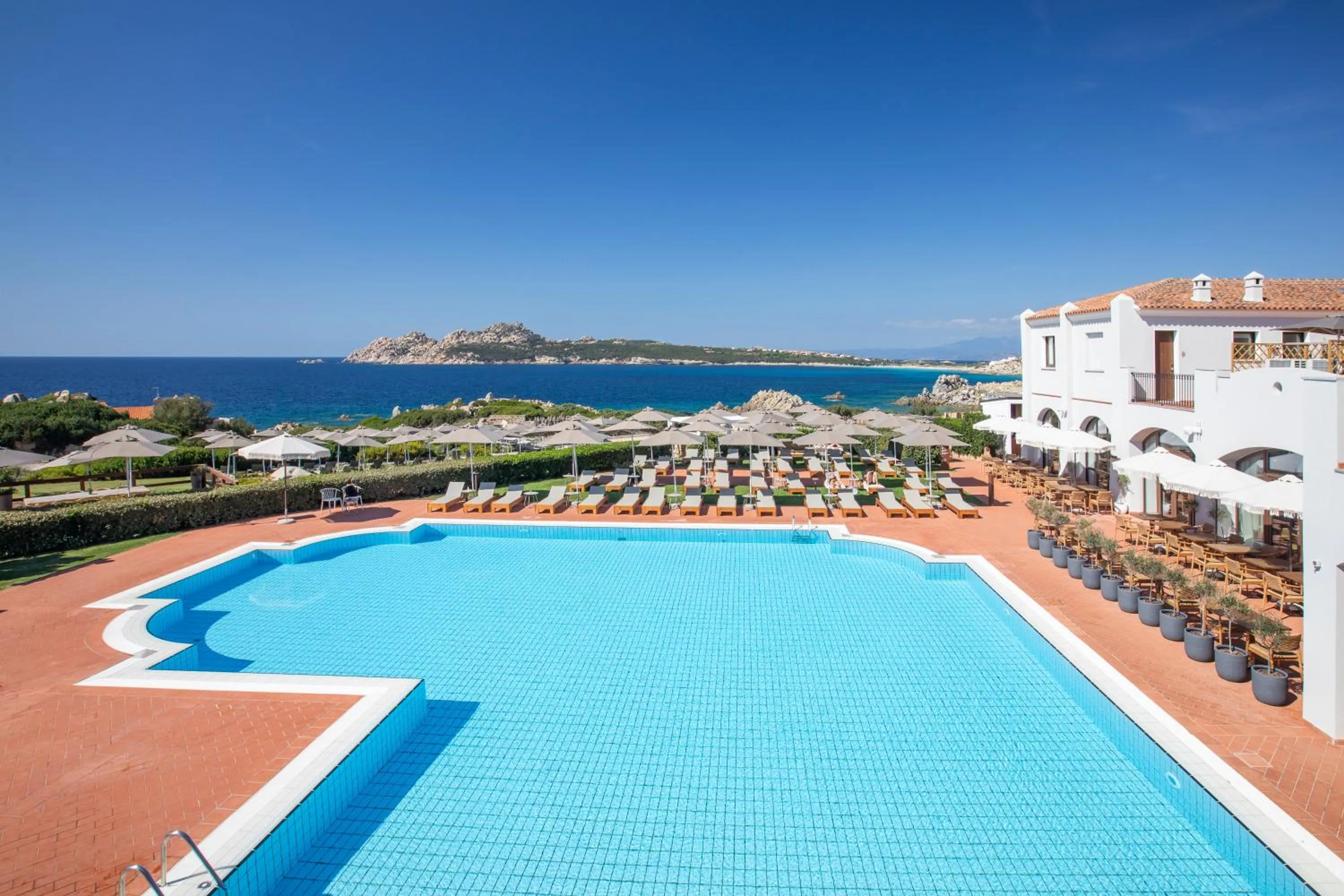 Swimming pool in Mangia's Santa Teresa Sardinia, Curio Collection by Hilton