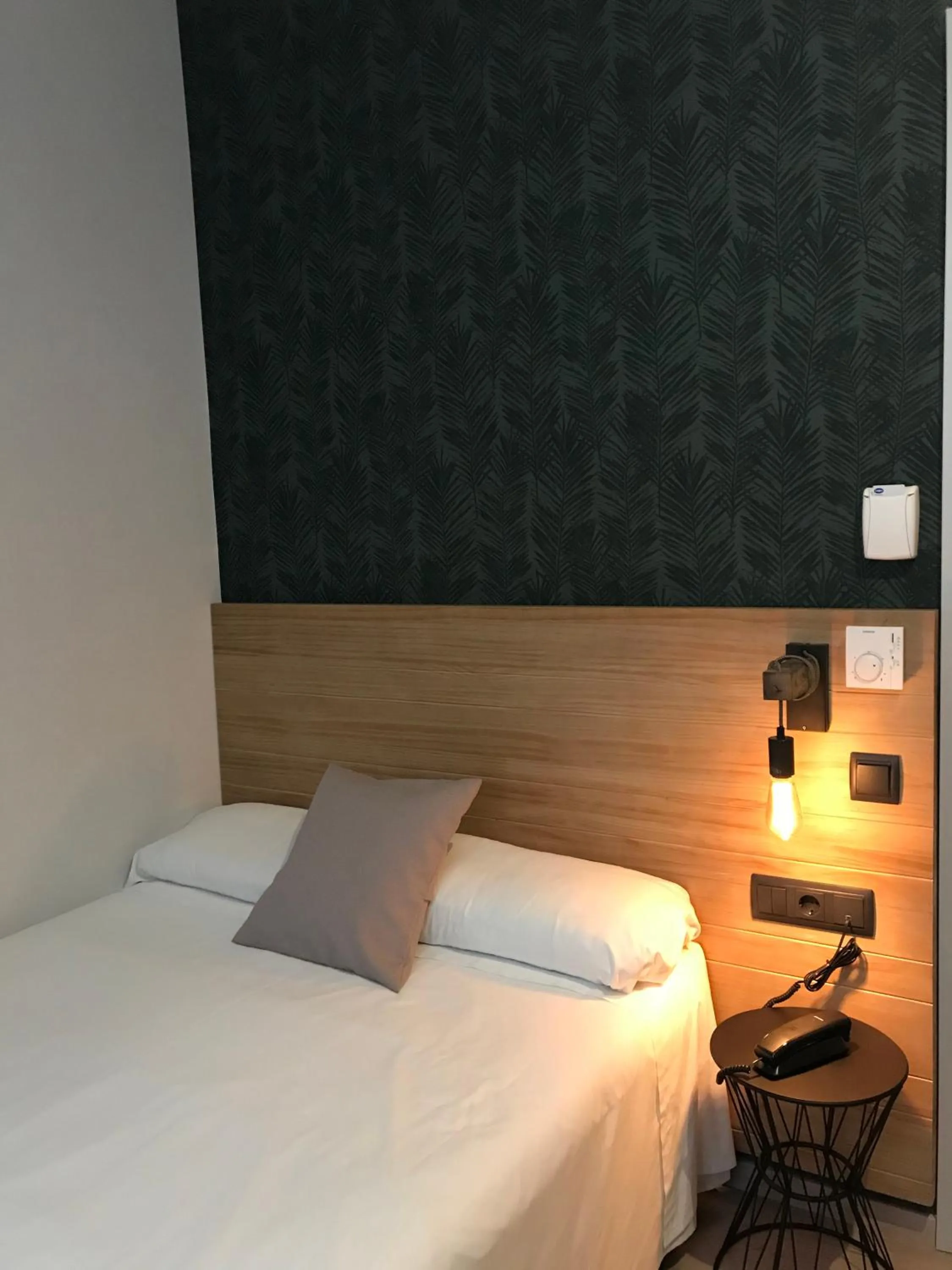 Bed in Hotel Cantón