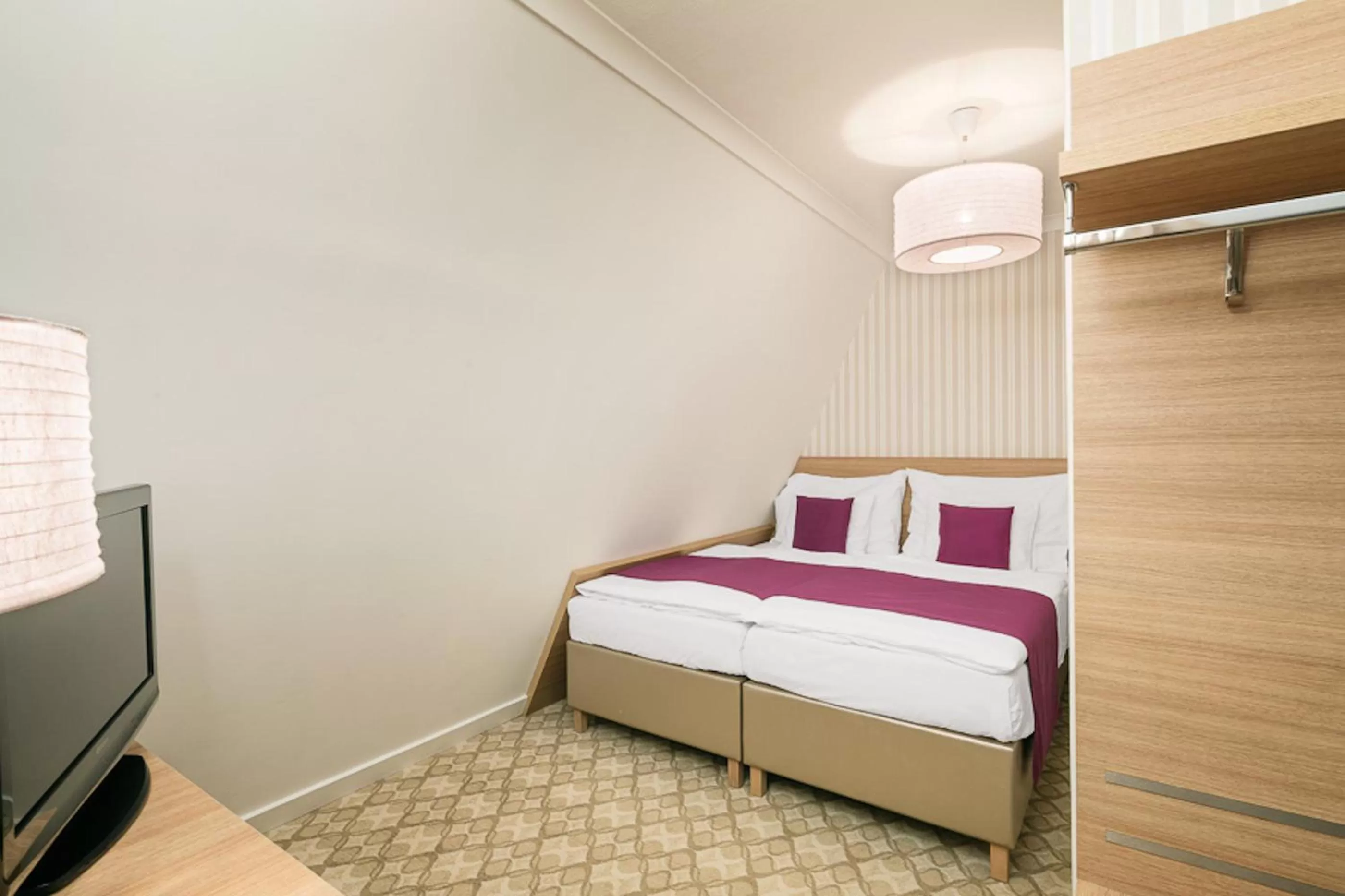 Bed in Pytloun Wellness Hotel Harrachov