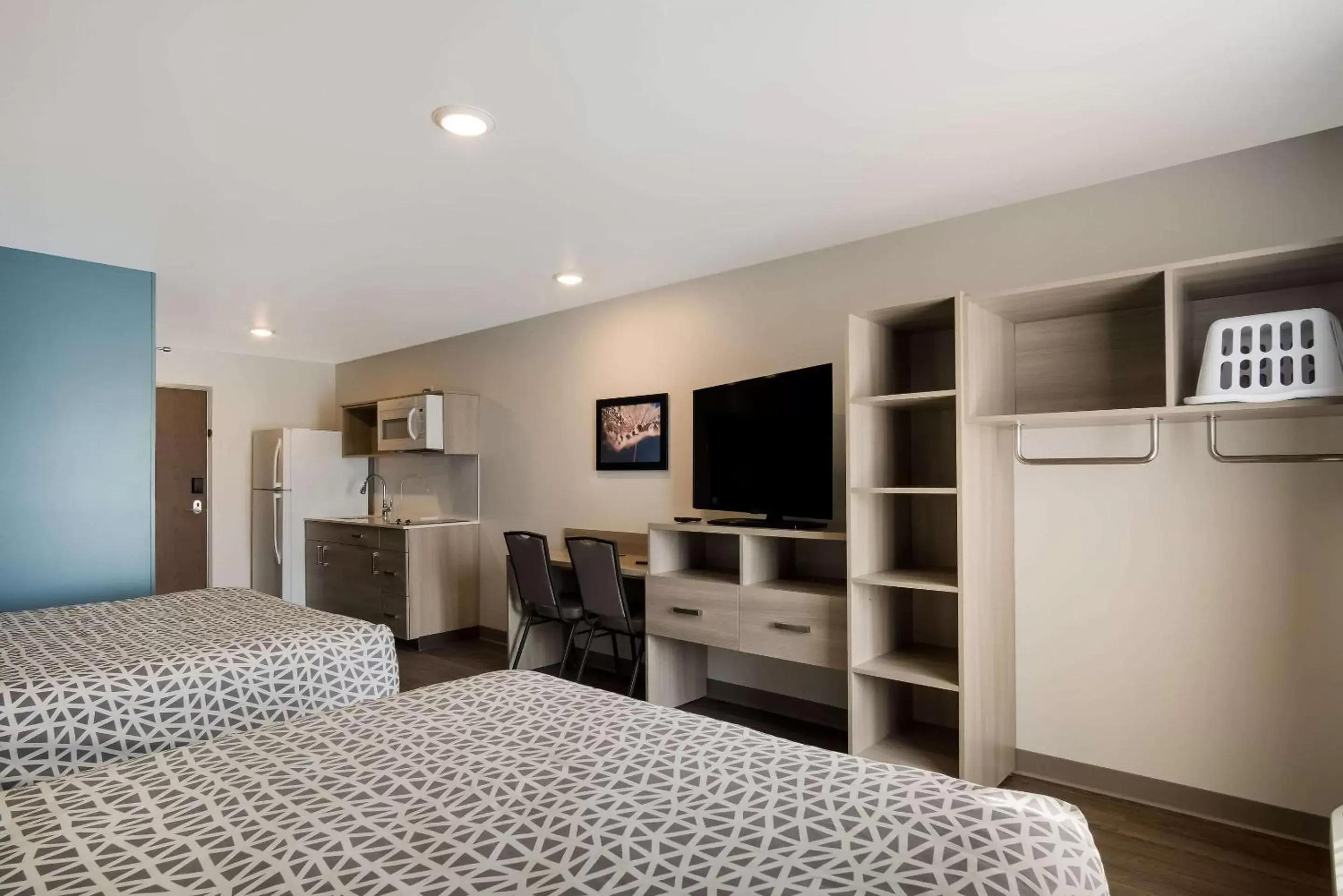 Bedroom, Bed in WoodSpring Suites Grand Rapids Kentwood