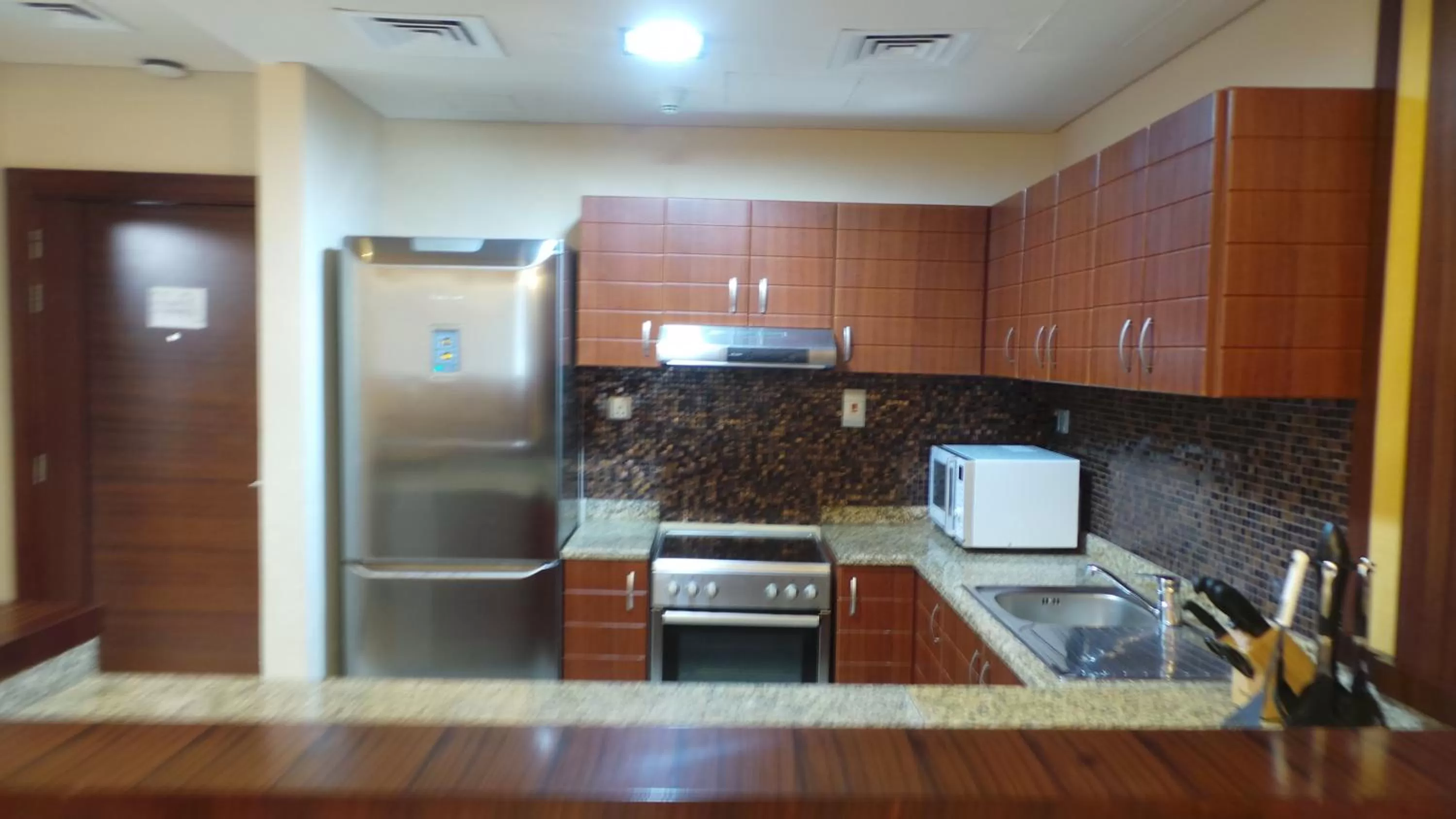 Kitchen or kitchenette in Xclusive Maples Hotel Apartment