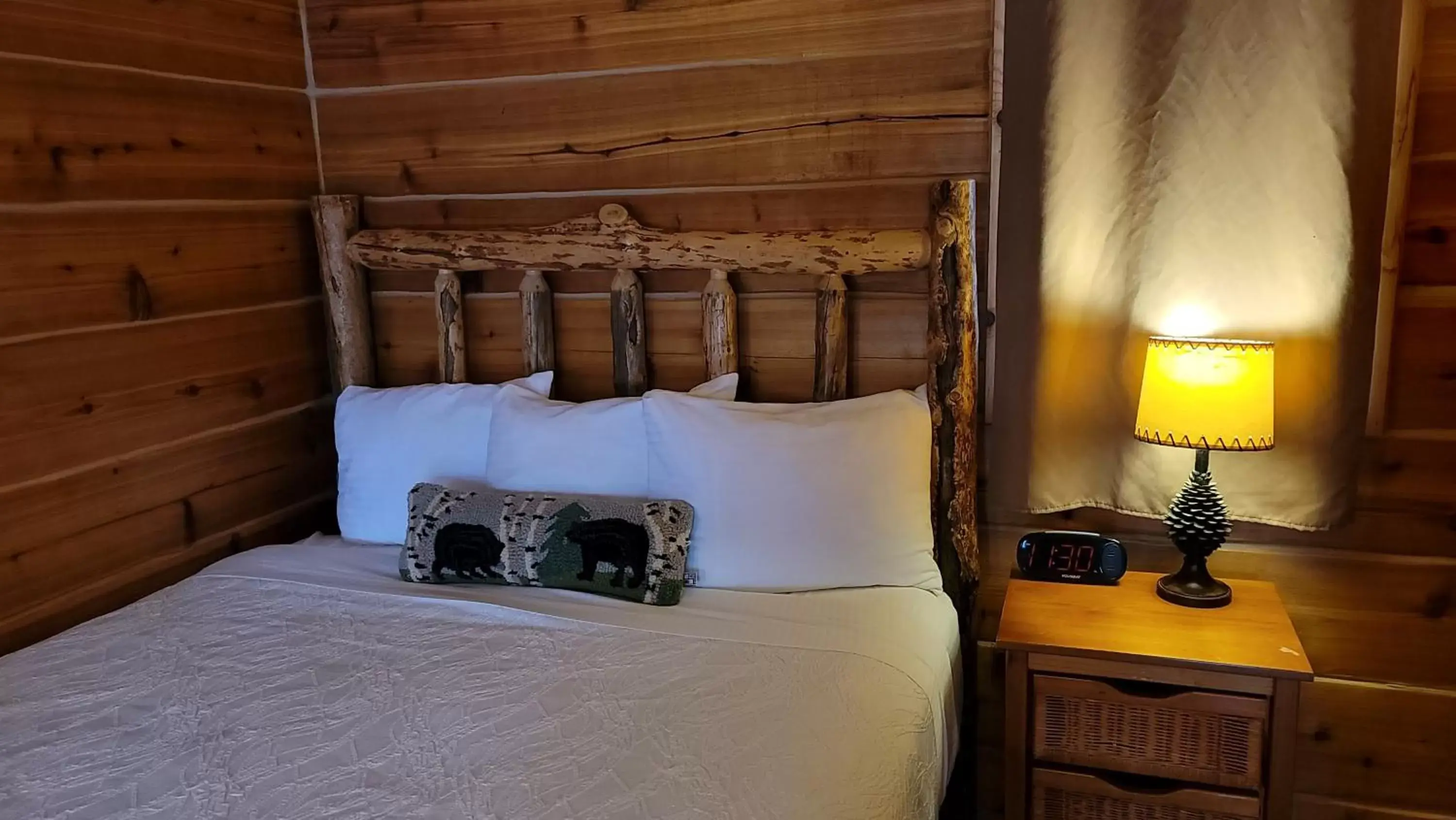 Bed in Riverfront Motel & Cabins