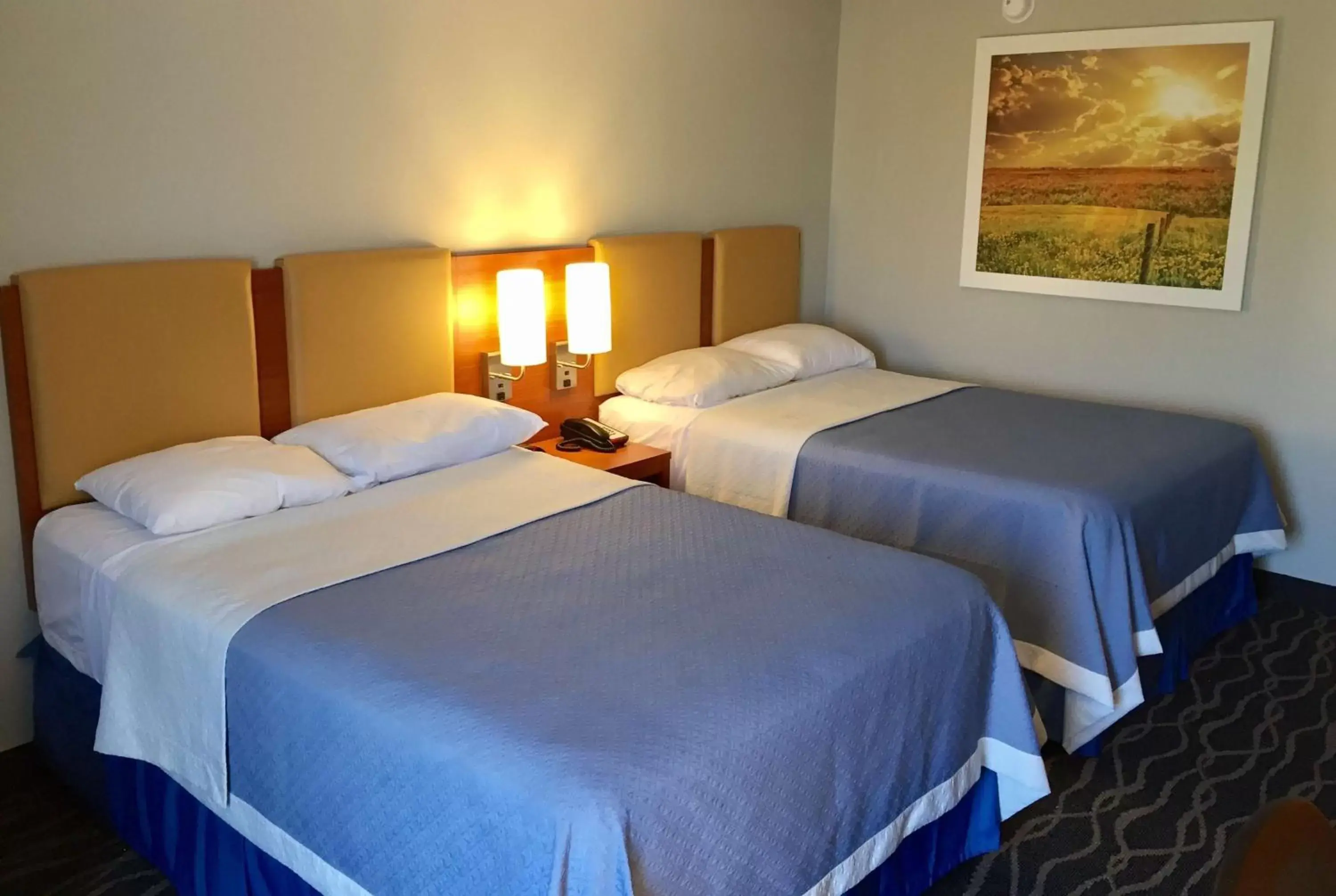 Photo of the whole room, Bed in Days Inn & Suites by Wyndham Cincinnati North