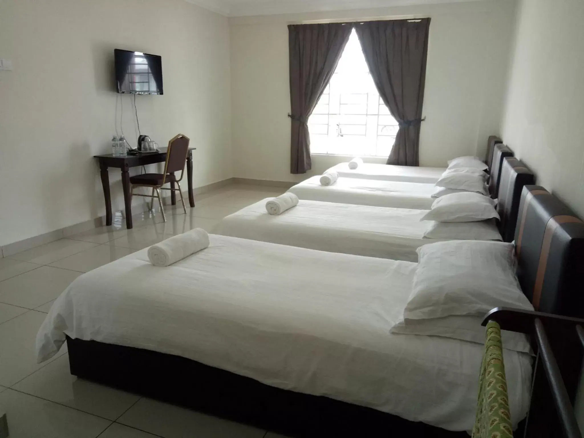 Bed in Hotel Mutiara KGMMB