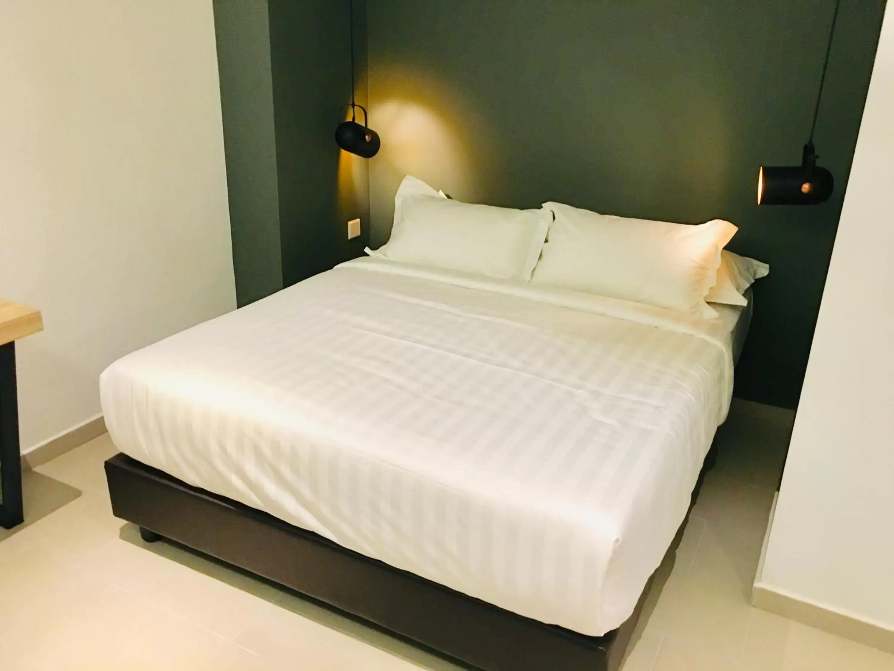 Bed in Enclave Hotel