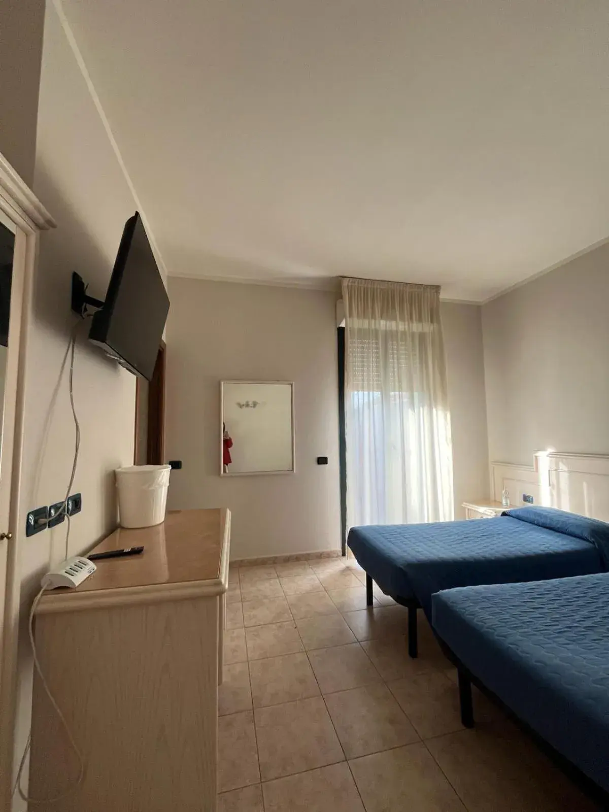 Bed, TV/Entertainment Center in Hotel Classicano