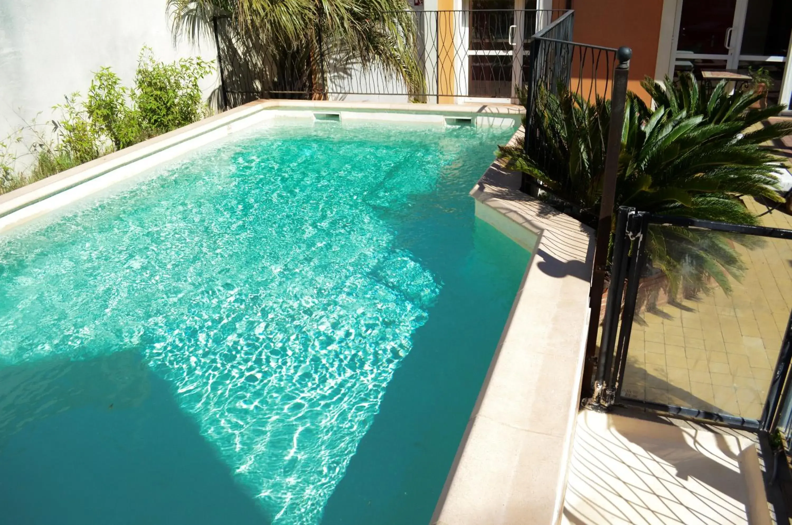 Patio, Swimming Pool in Logis Hotel De La Clape