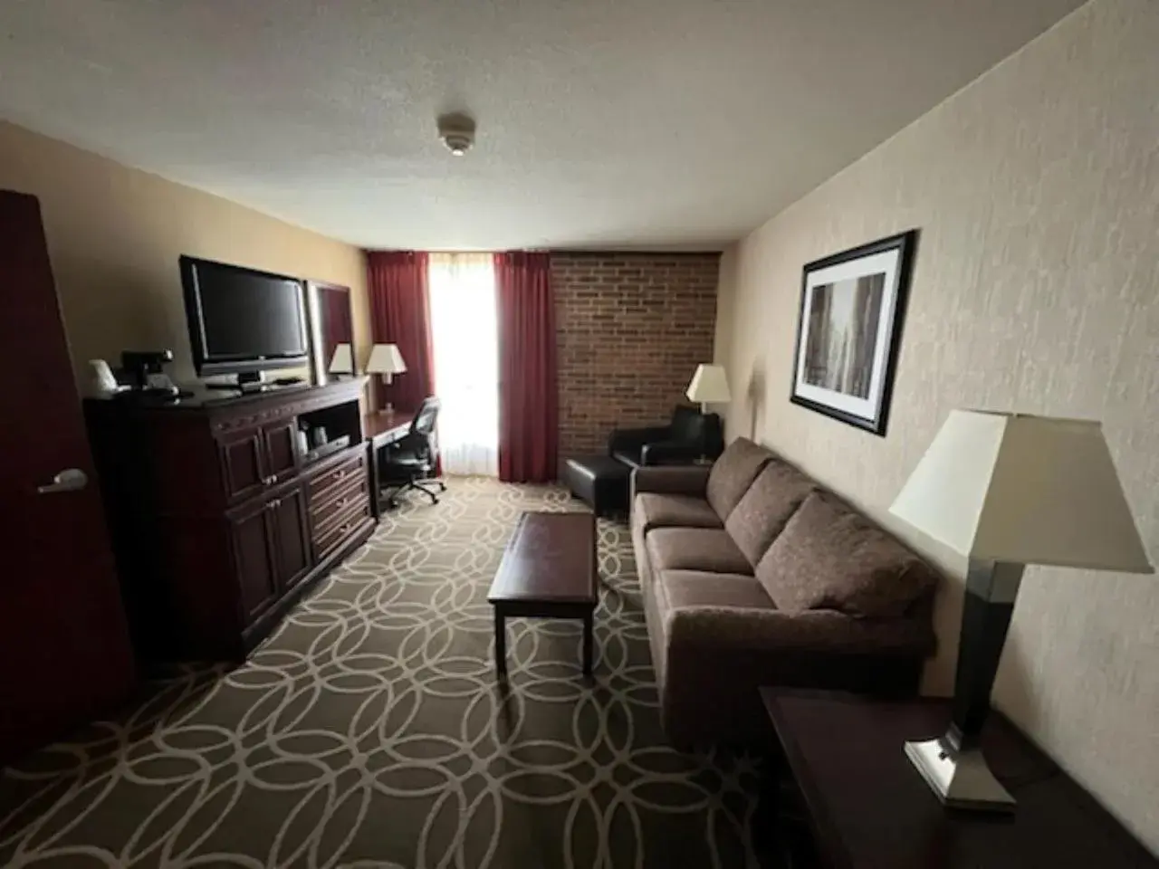 TV and multimedia, Seating Area in Hotel Lotus Kansas City Merriam