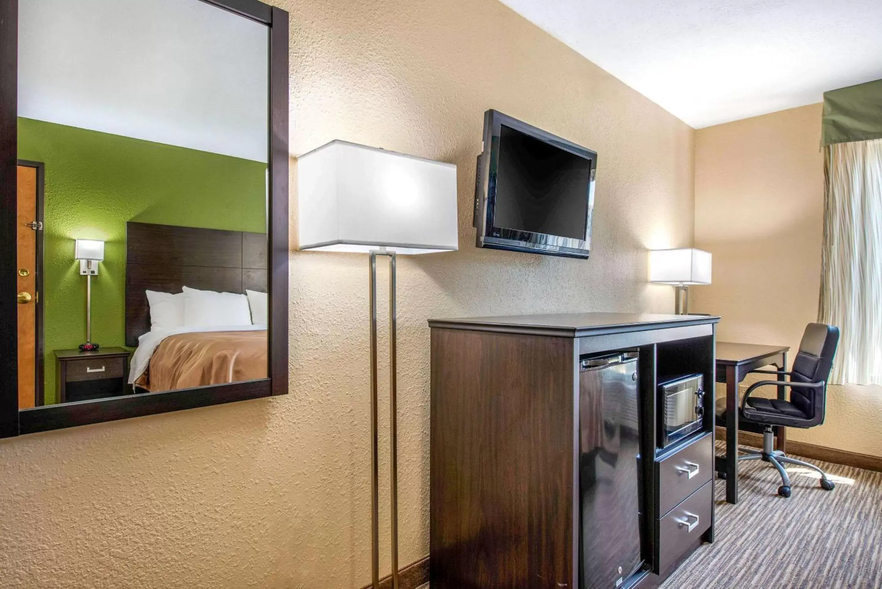 Photo of the whole room, TV/Entertainment Center in Quality Inn & Suites