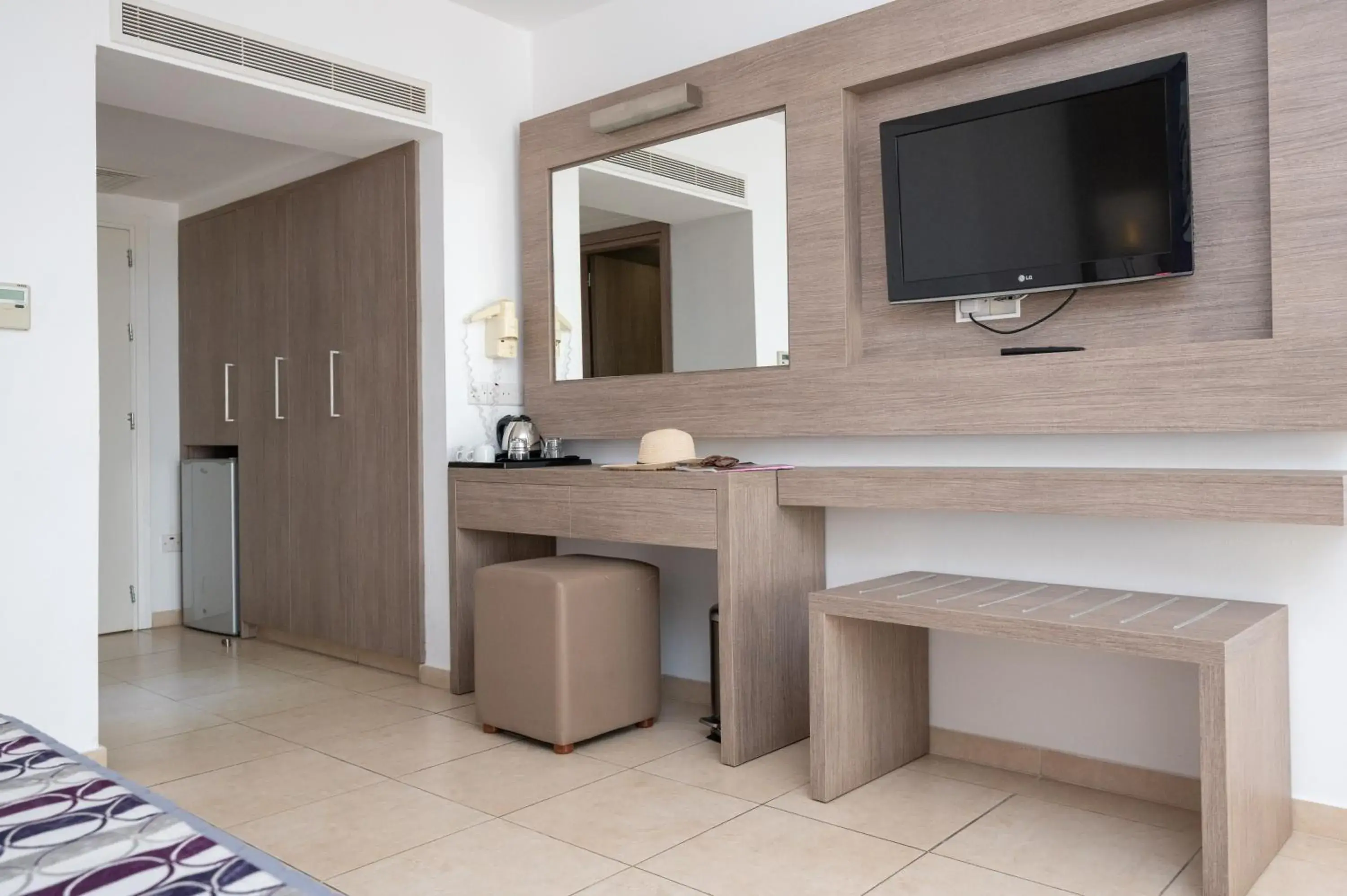 TV/Entertainment Center in New Famagusta Hotel & Suites