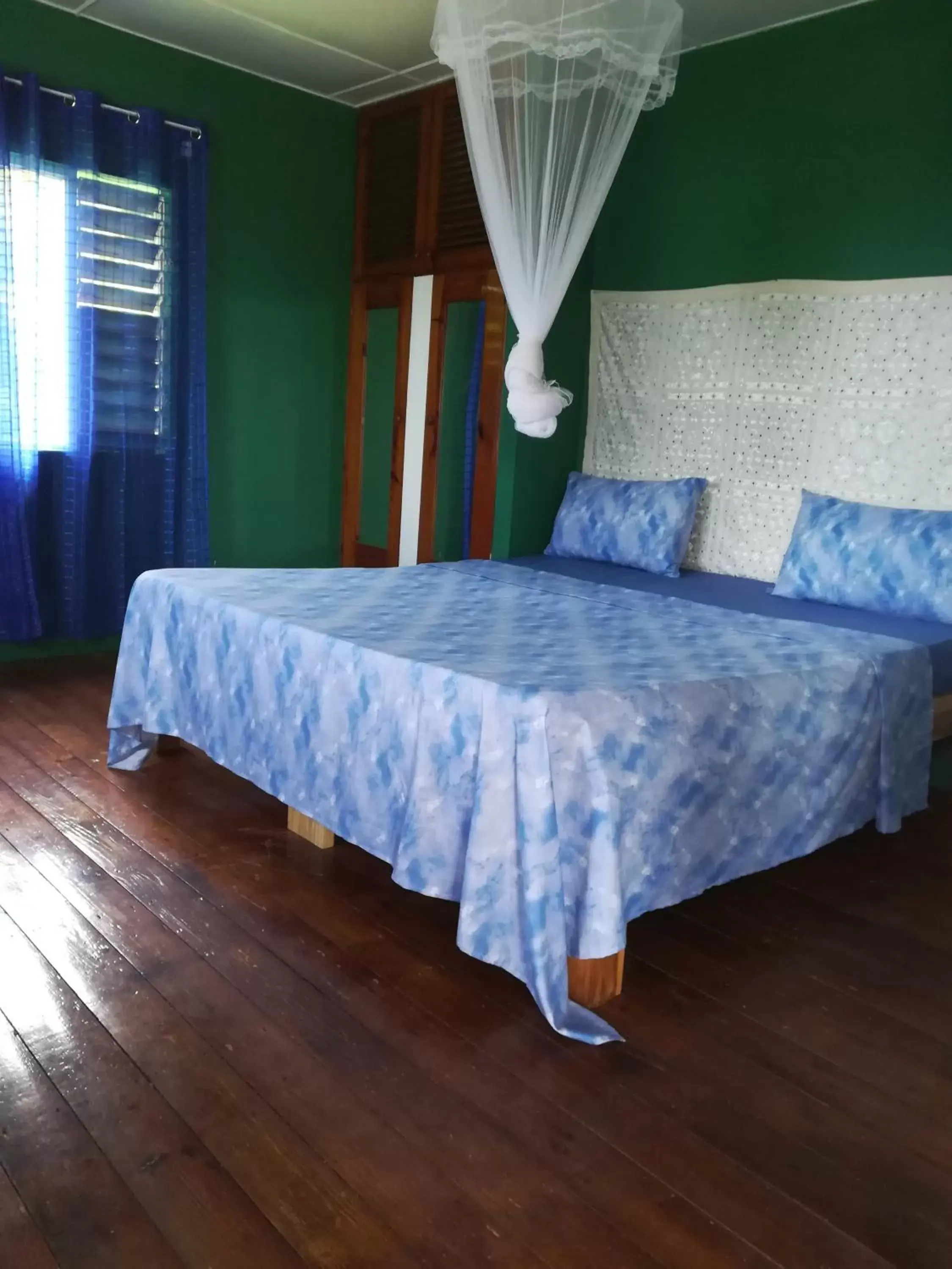 Bed in TOGA GUEST HOUSE