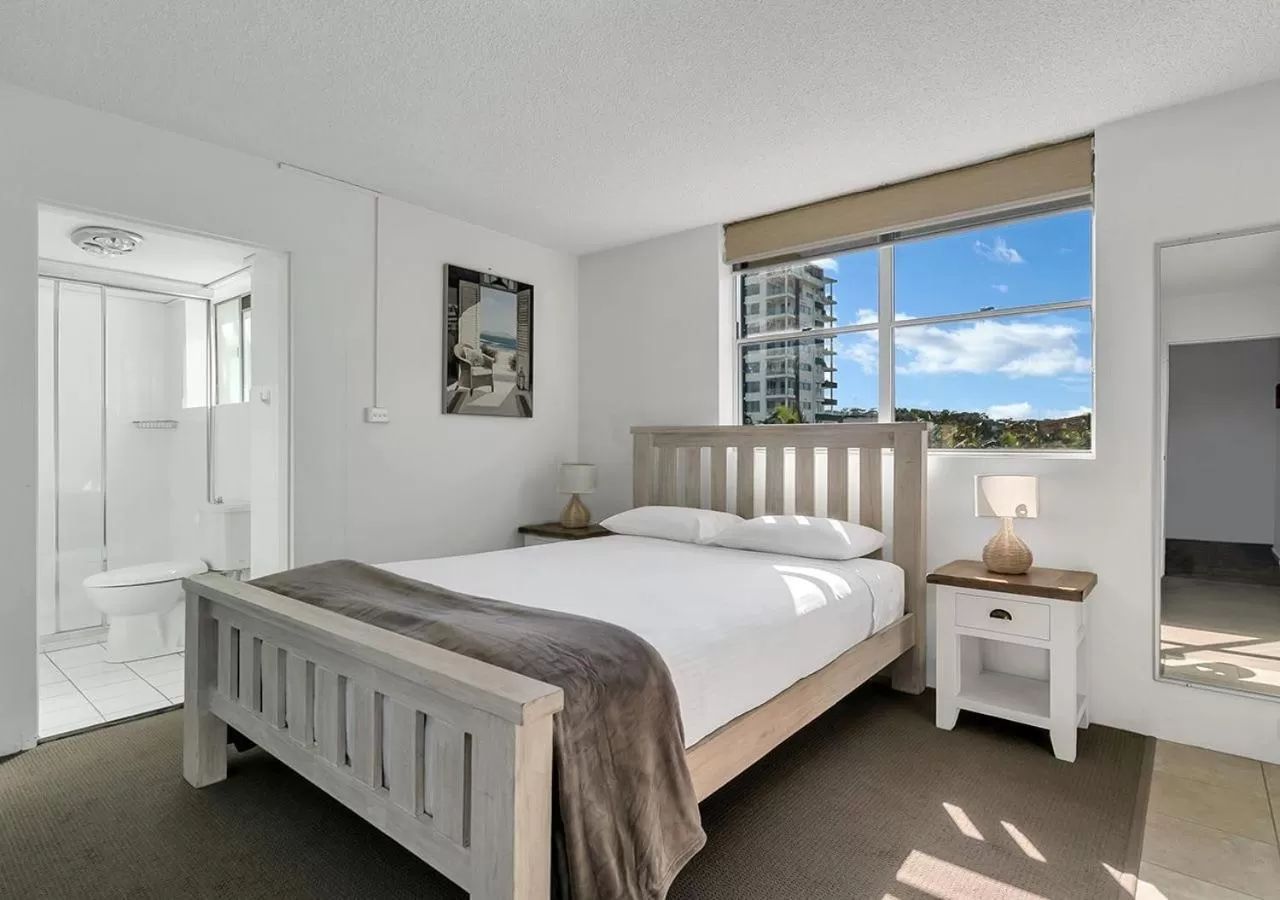 Bed in Tradewinds Apartments