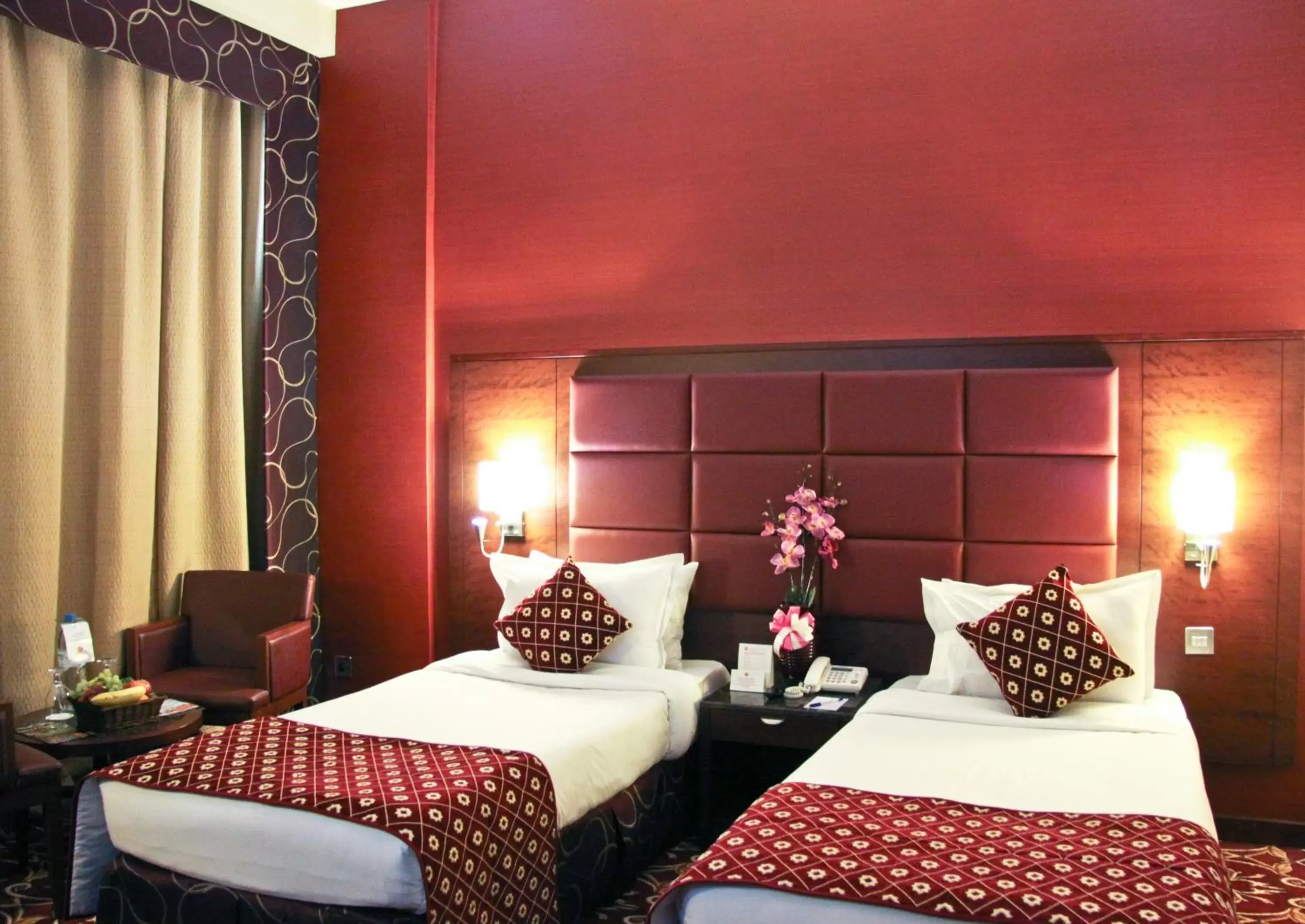 Bed in Ramee Rose Hotel