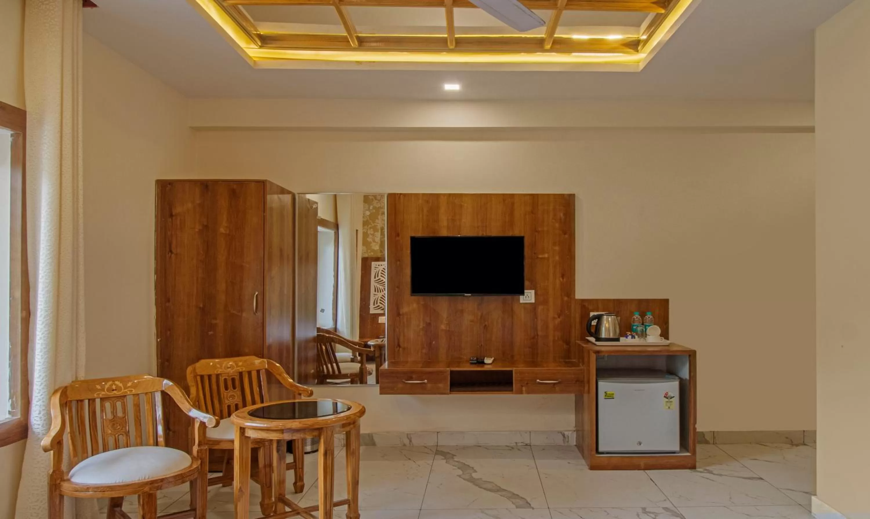 TV/Entertainment Center in Treebo Trend Haveli Resort Roots Bhupatwala