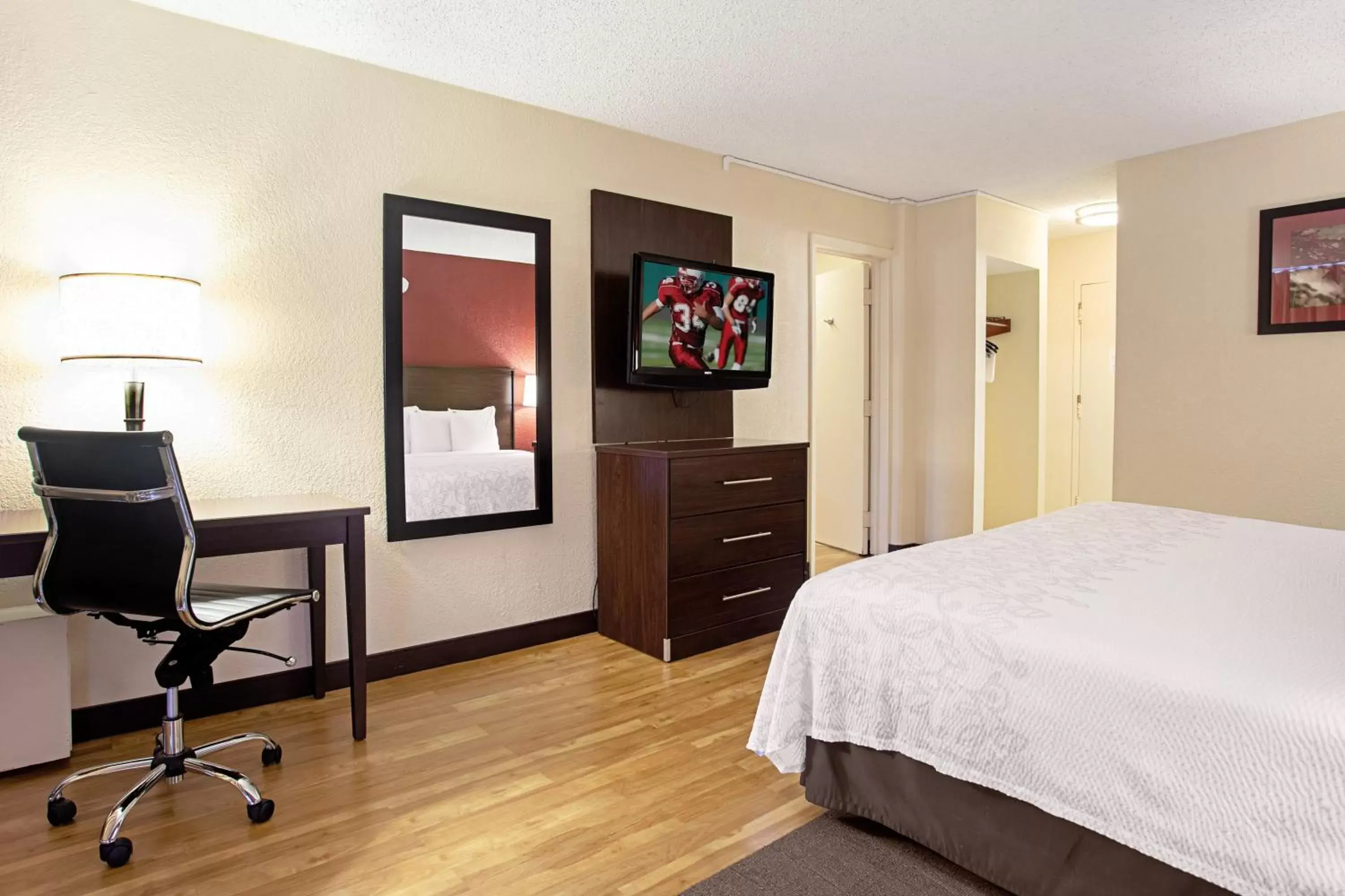 Photo of the whole room, TV/Entertainment Center in Red Roof Inn PLUS+ Wichita East