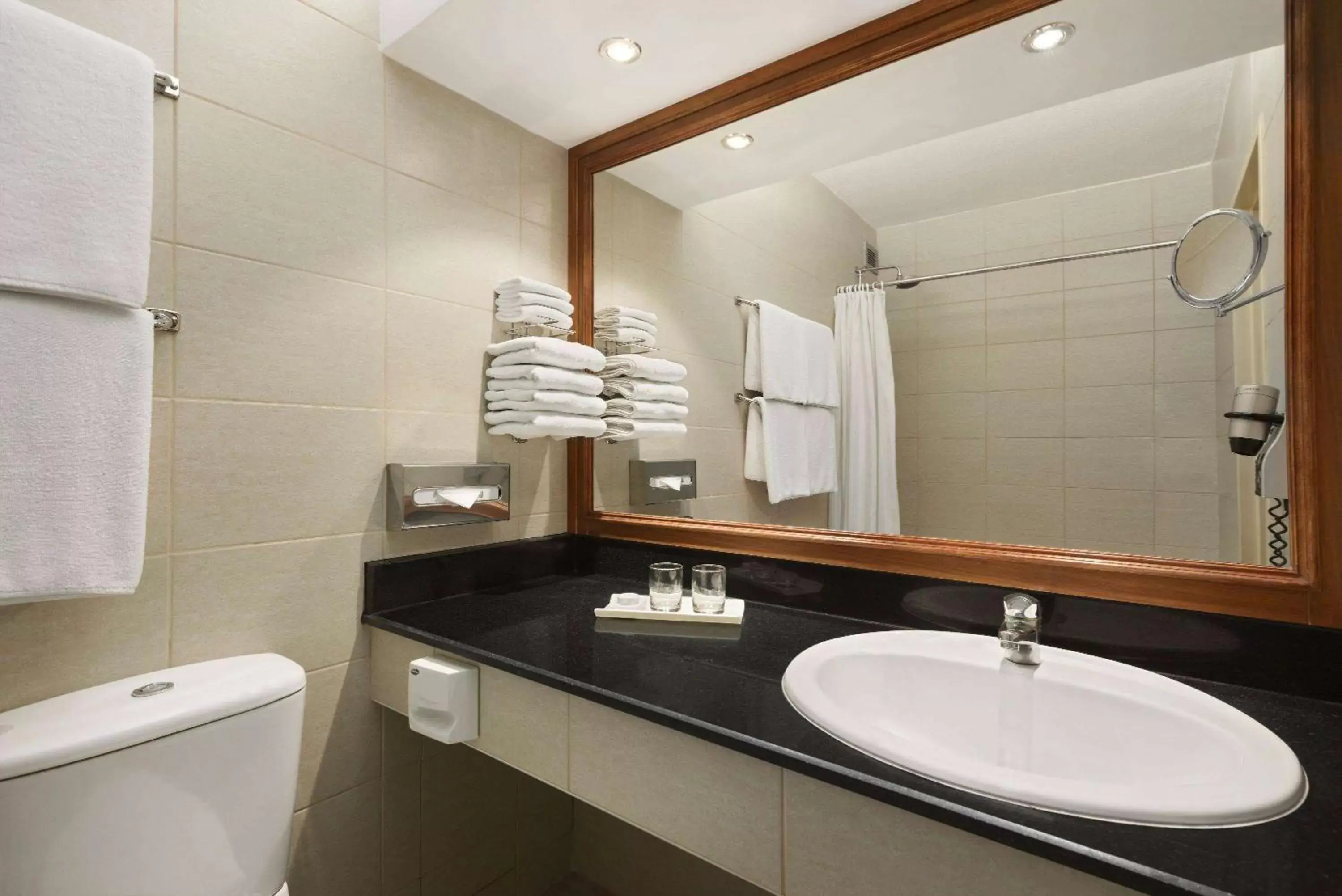 TV and multimedia, Bathroom in Ramada by Wyndham Bahrain