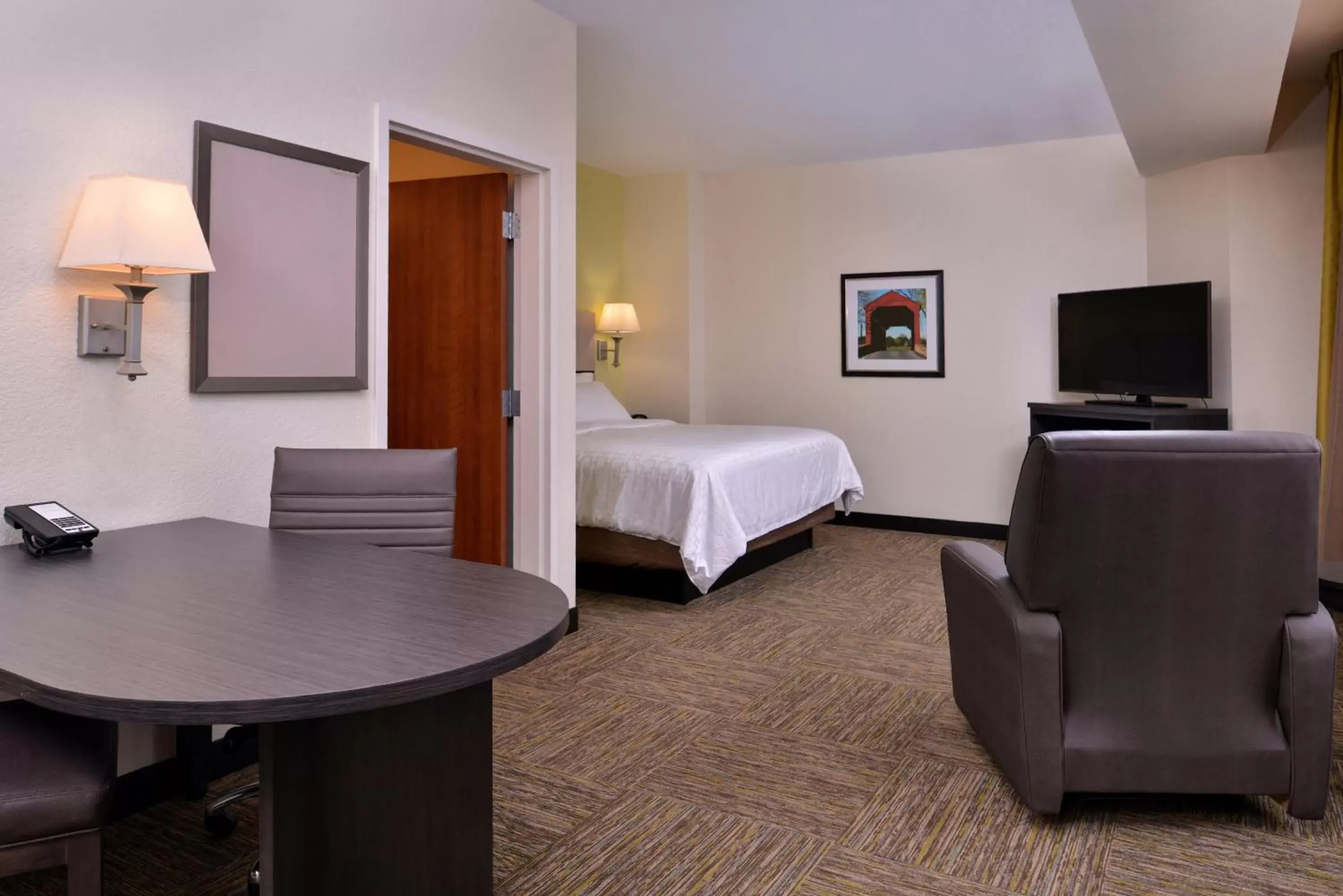 Photo of the whole room, TV/Entertainment Center in Candlewood Suites Terre Haute, an IHG Hotel