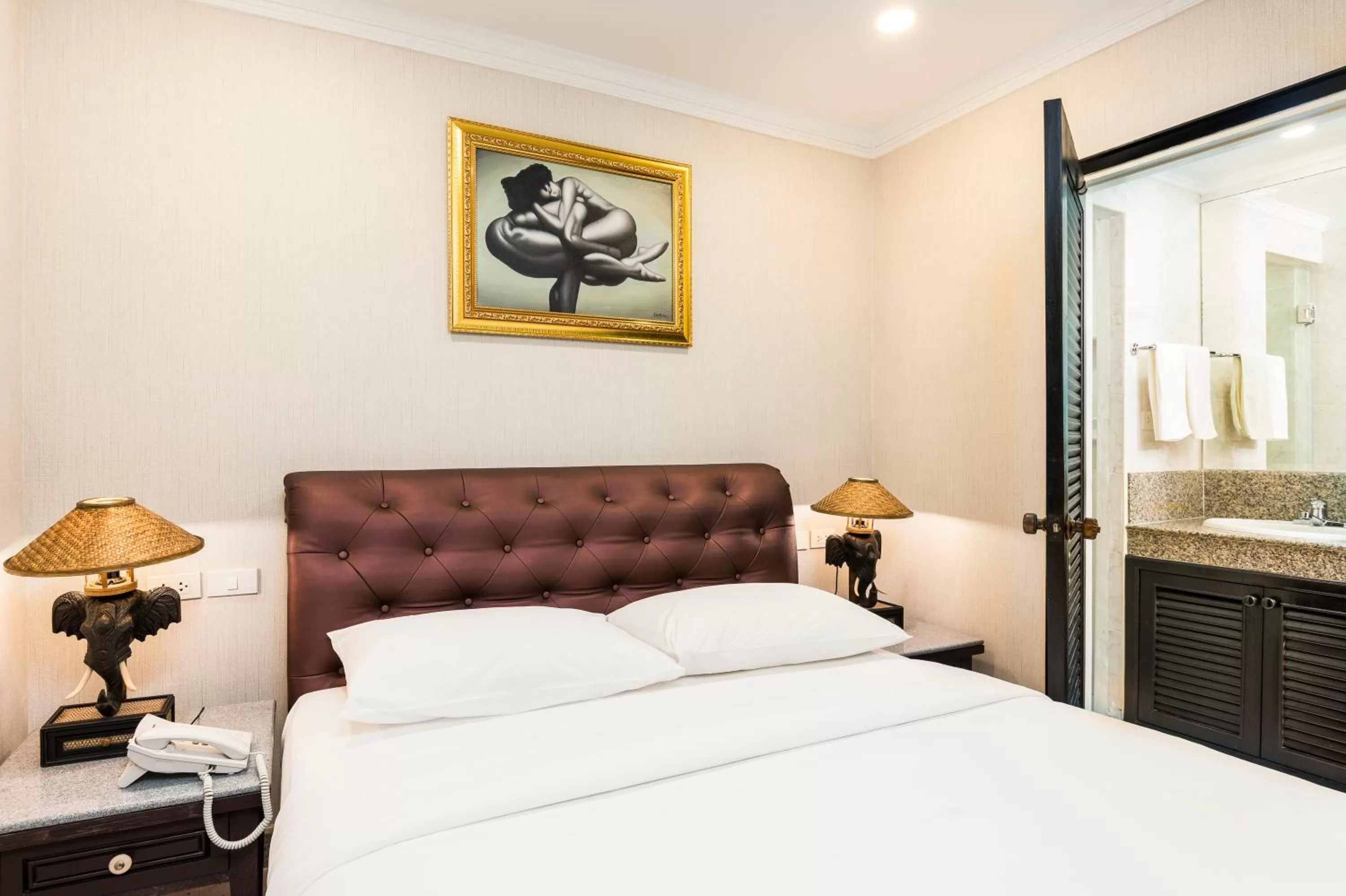 Bed in The Ambiance Hotel