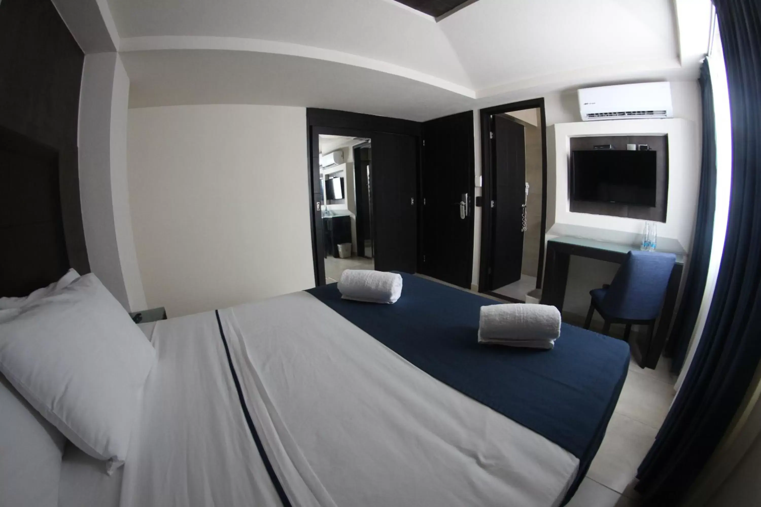 Photo of the whole room, Bed in Hotel Portonovo Plaza Malecon
