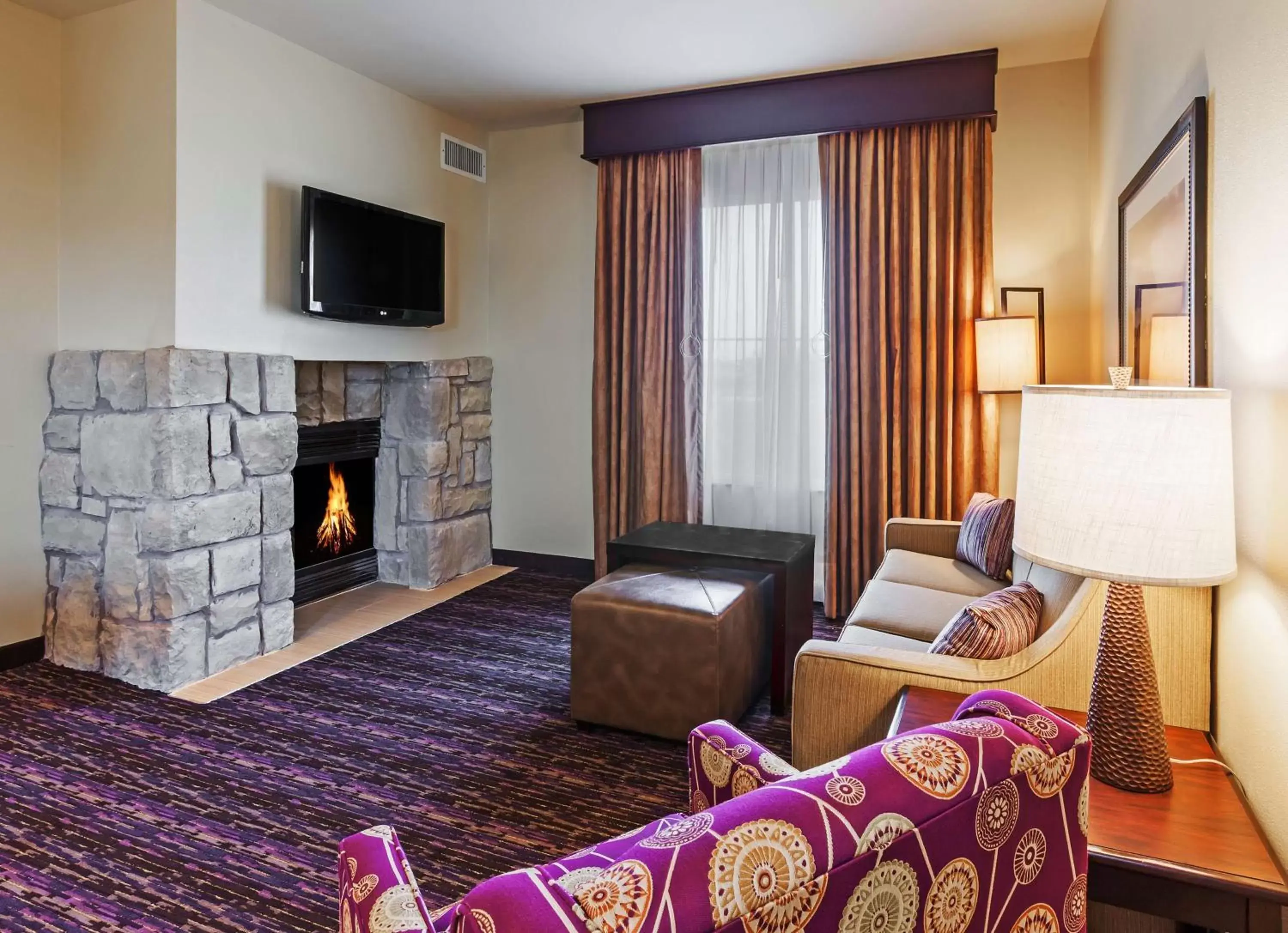 Bed, Seating Area in Homewood Suites Wichita Falls