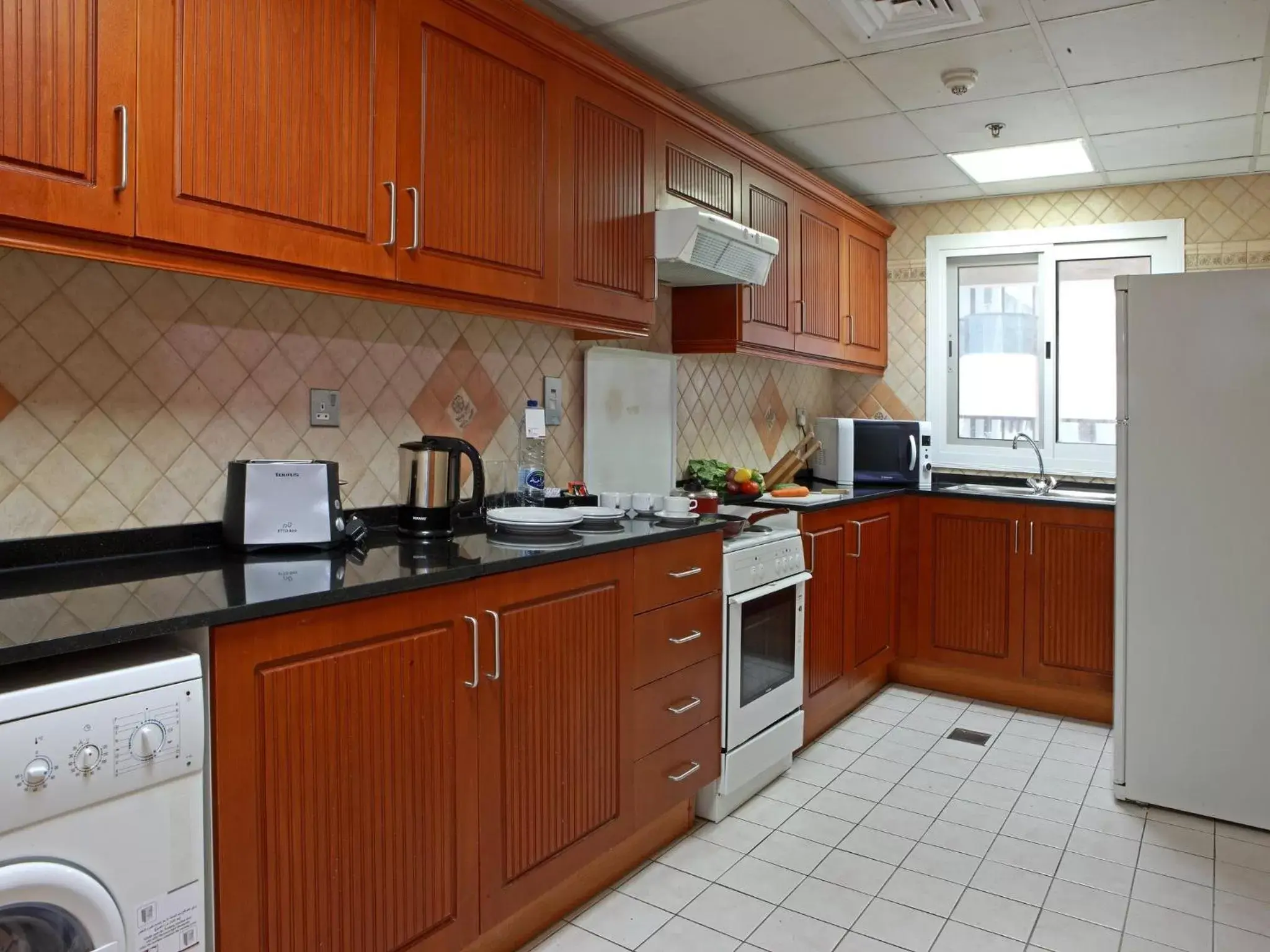 Kitchen or kitchenette, Kitchen/Kitchenette in Rose Garden Hotel Apartments - Bur Dubai