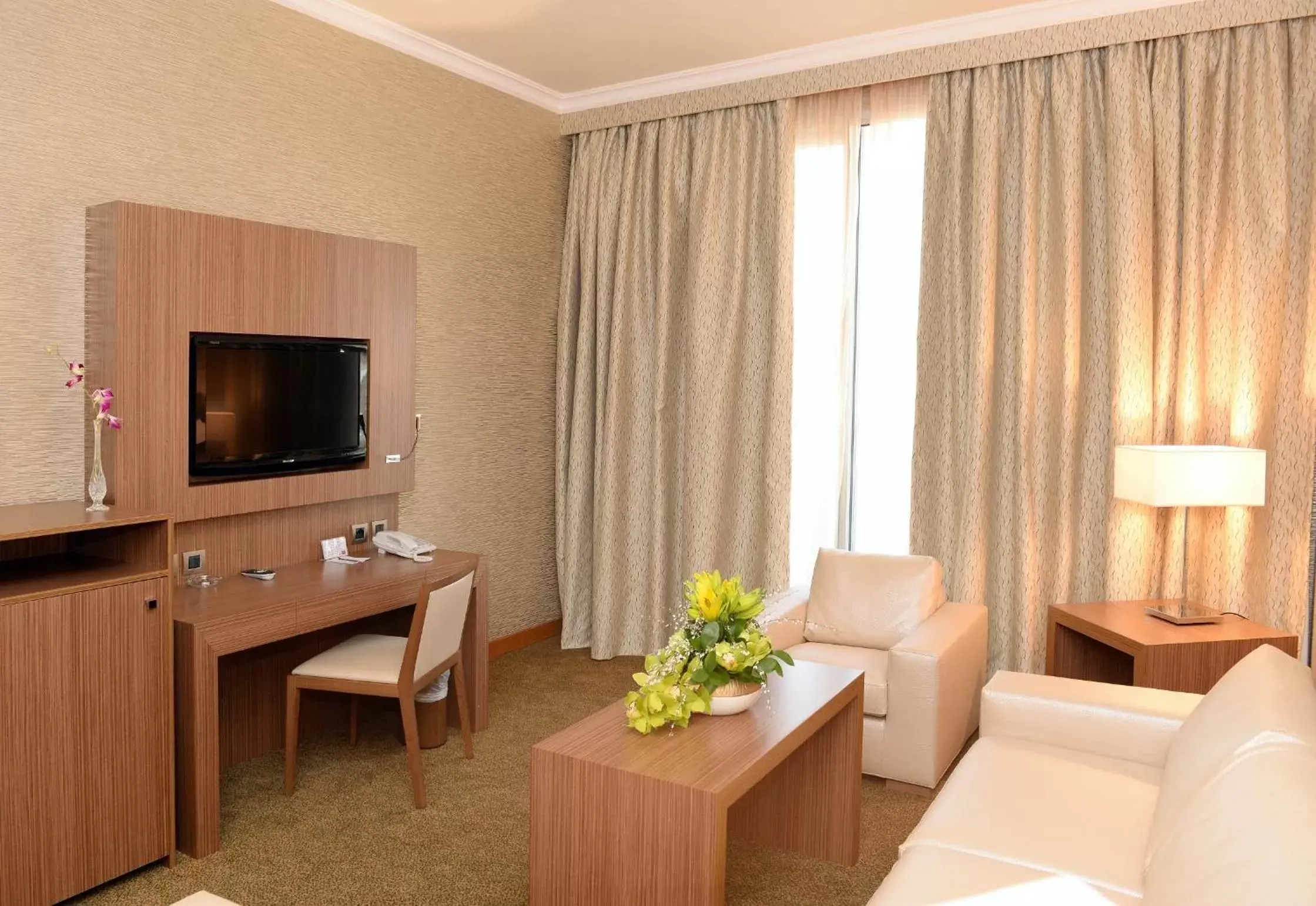 Living room, TV/Entertainment Center in M Grand Hotel Doha