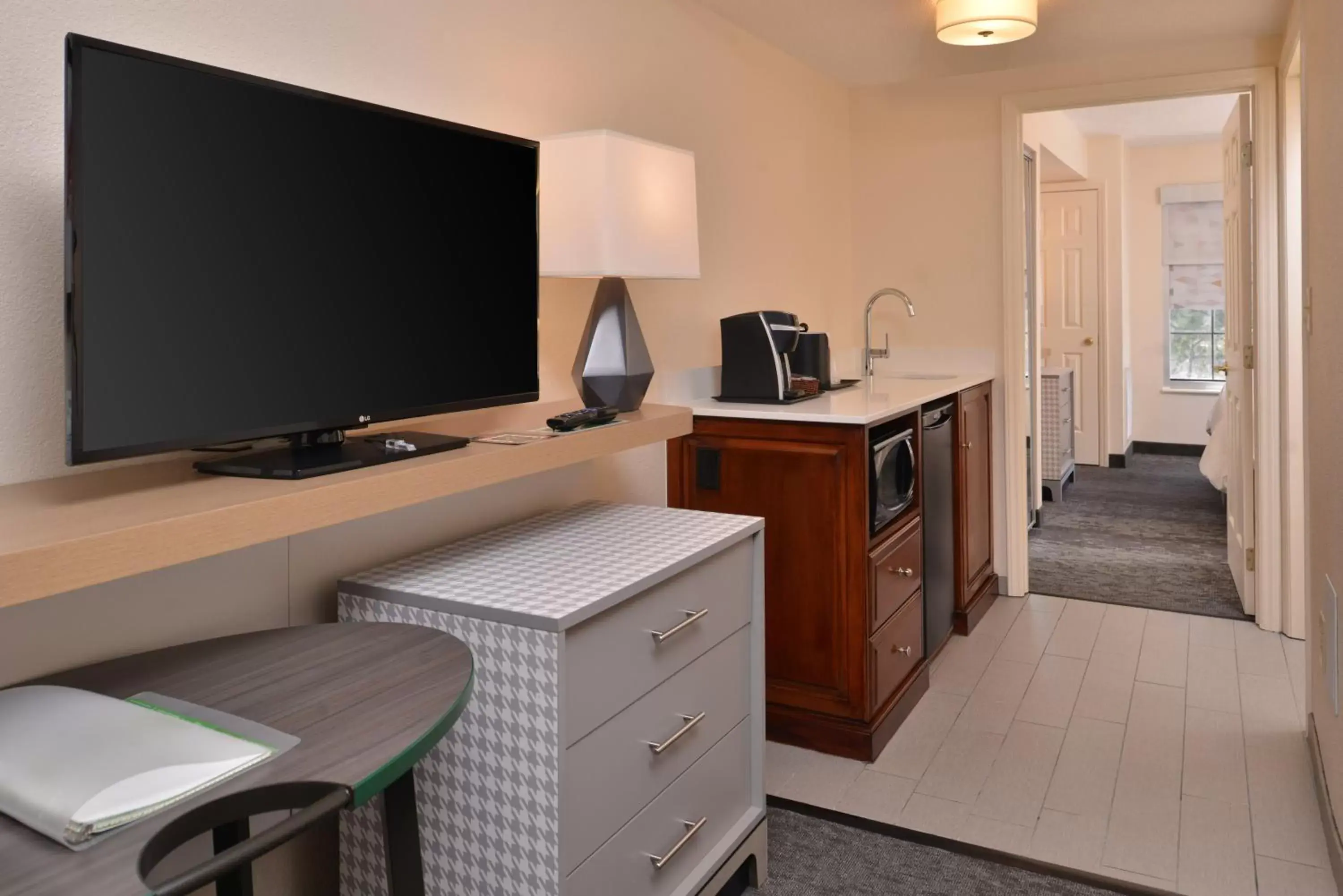 Photo of the whole room, TV/Entertainment Center in Holiday Inn & Suites Raleigh Cary, an IHG Hotel