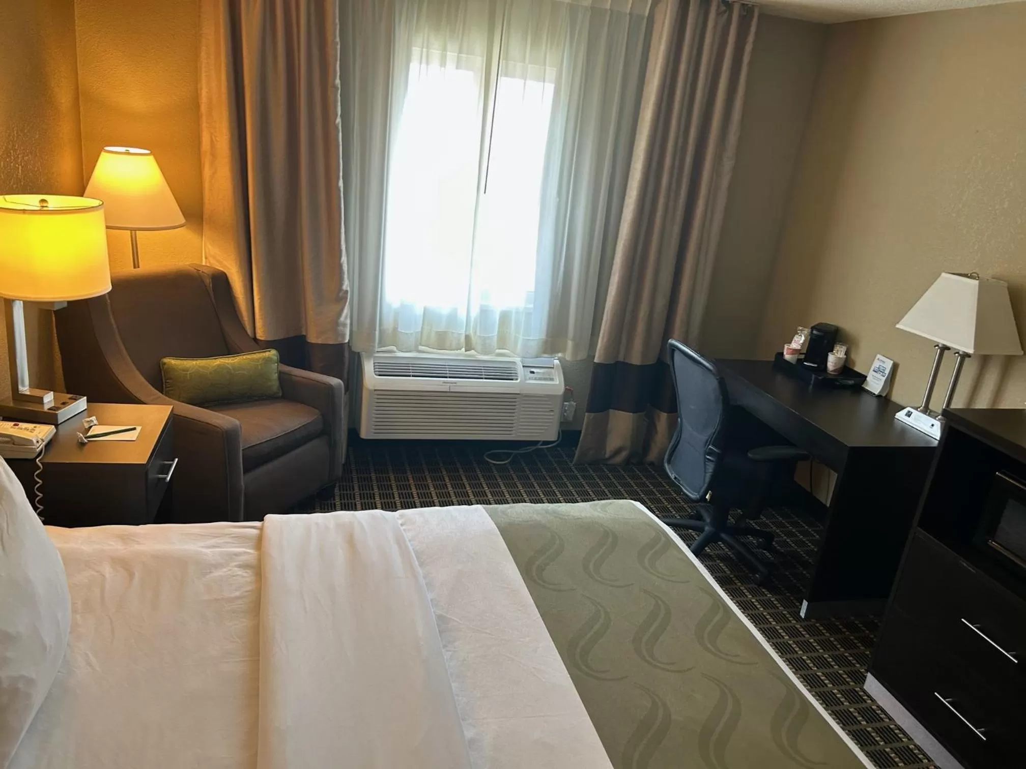 Bed in Quality Inn & Suites