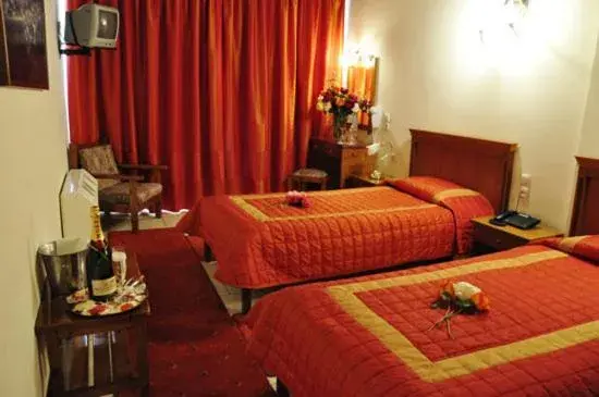 Bed in Famissi Eden Hotel
