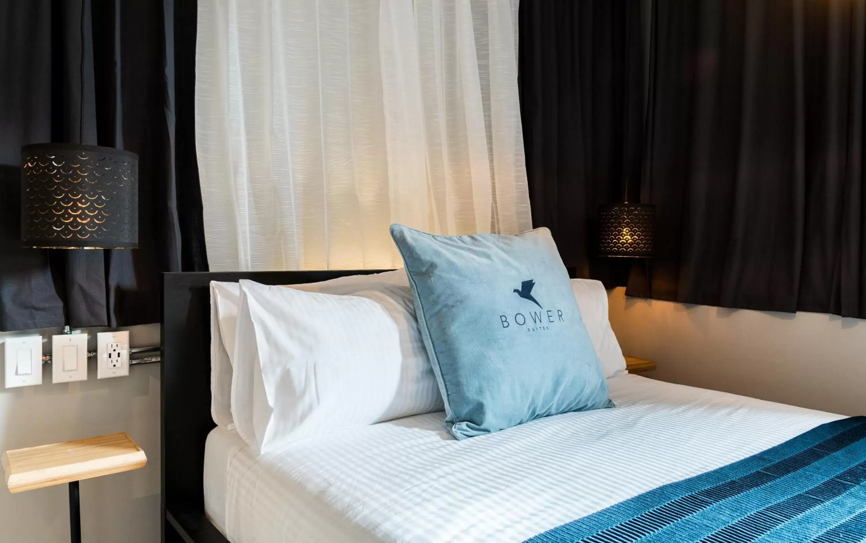 Bed in Capitol Robinson by Bower Hotels & Suites