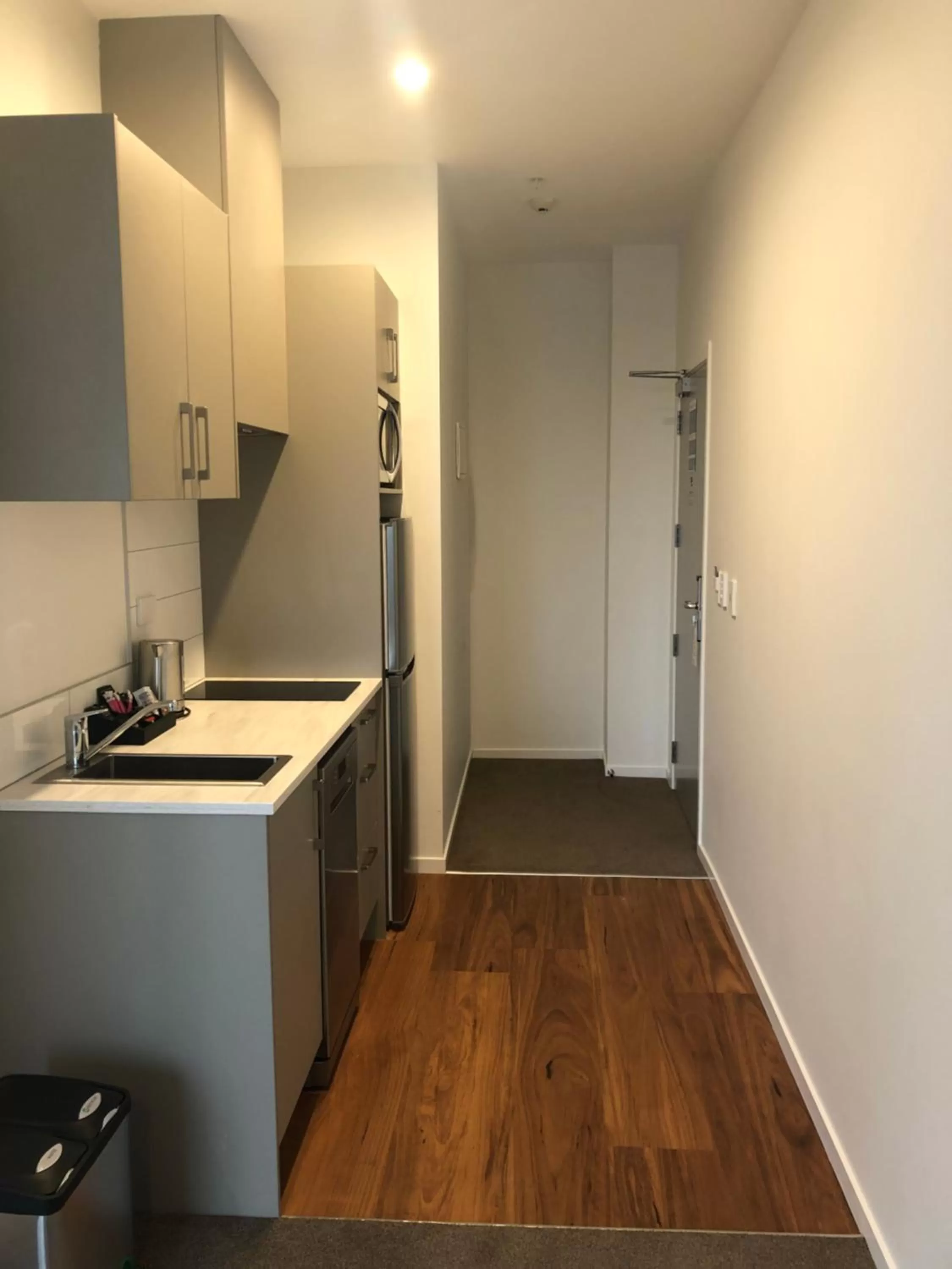 Kitchen or kitchenette in Ramada Suites by Wyndham Auckland Manukau Pacfic Centre