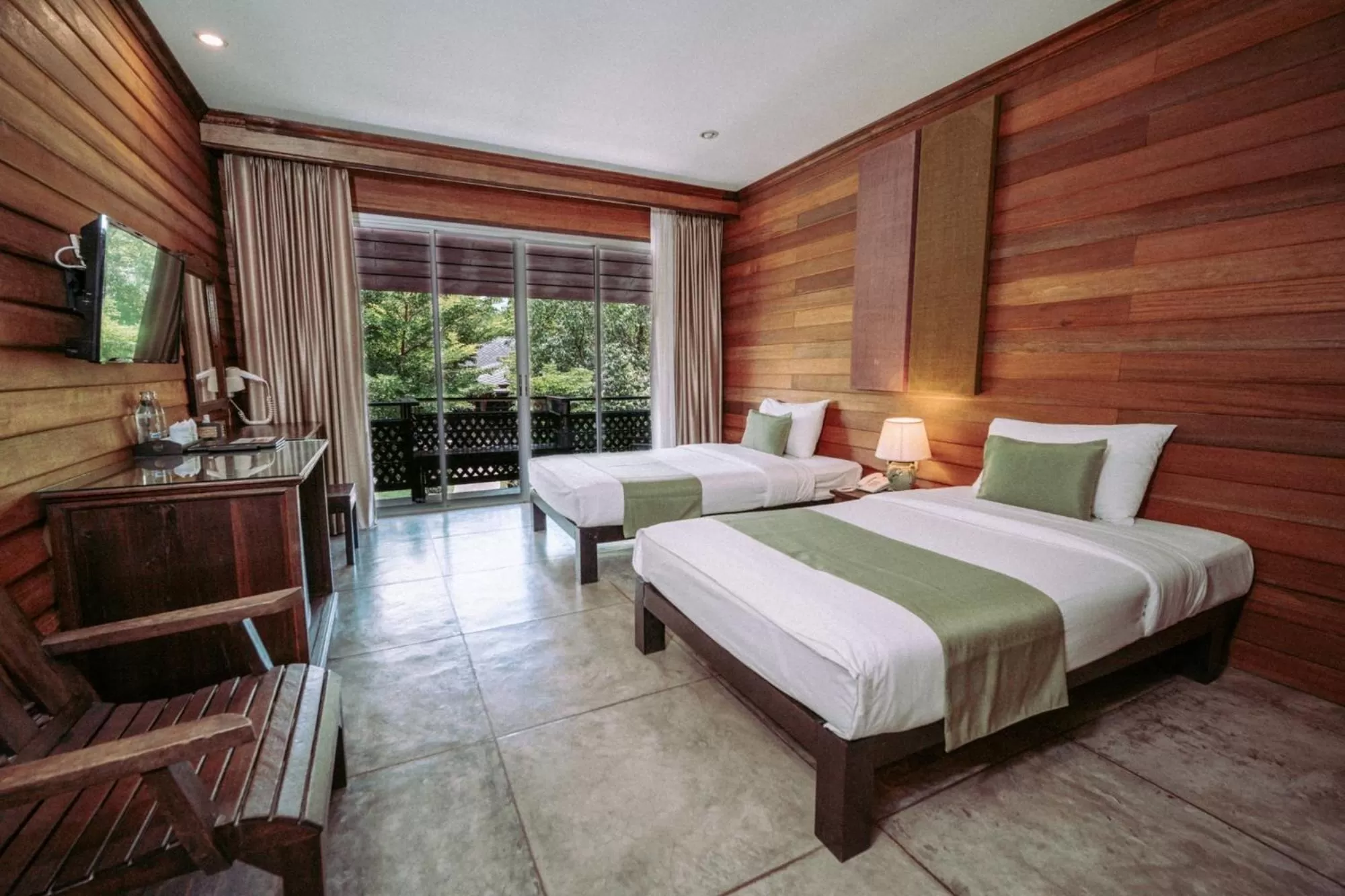 Bed in Royal River Kwai Resort and Spa