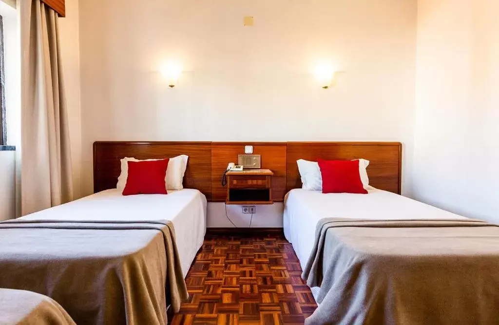 Bed in Dona Amélia Hotel by RIDAN Hotels