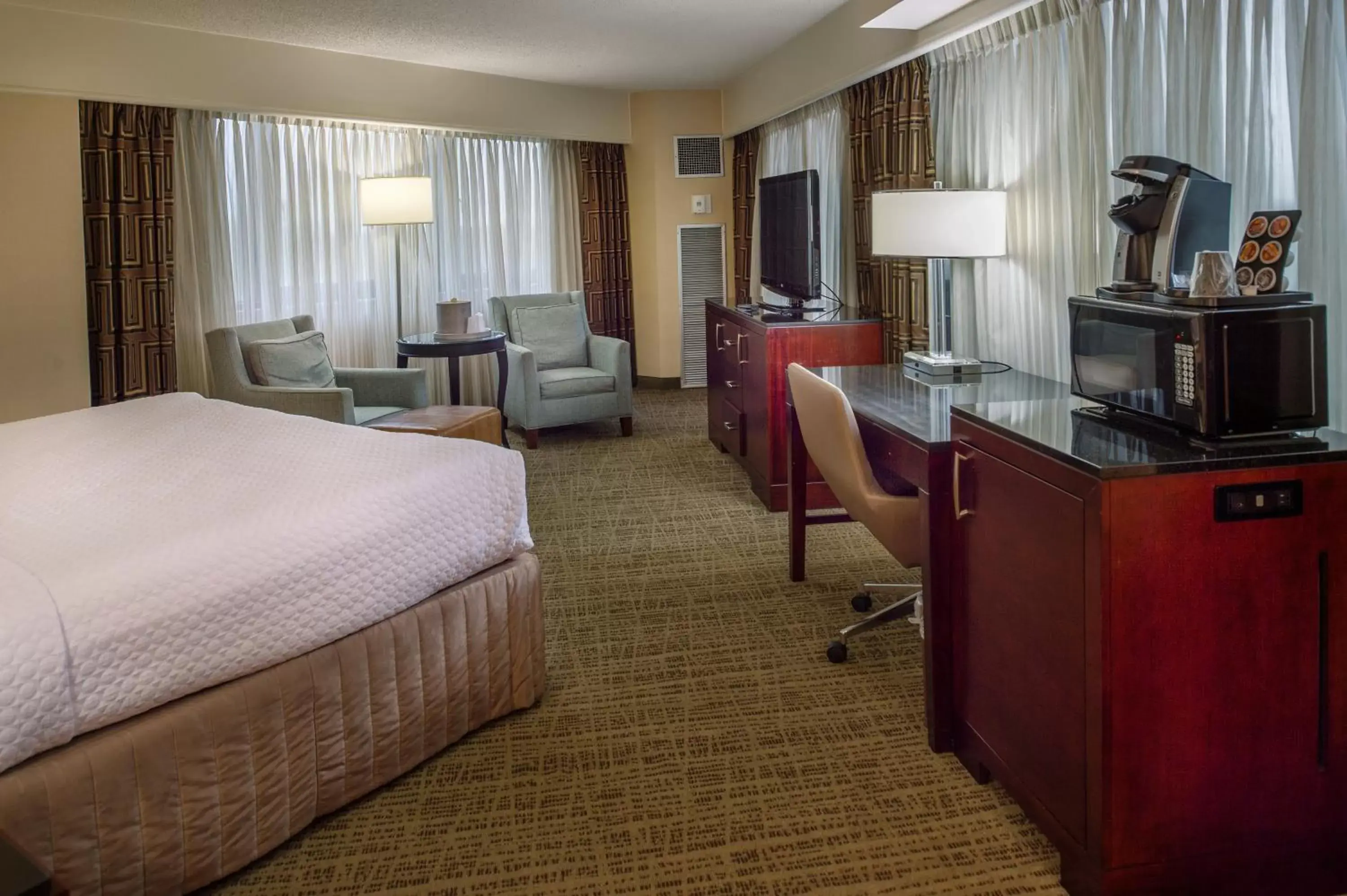 Photo of the whole room, TV/Entertainment Center in Crowne Plaza Hotel St. Louis Airport, an IHG Hotel