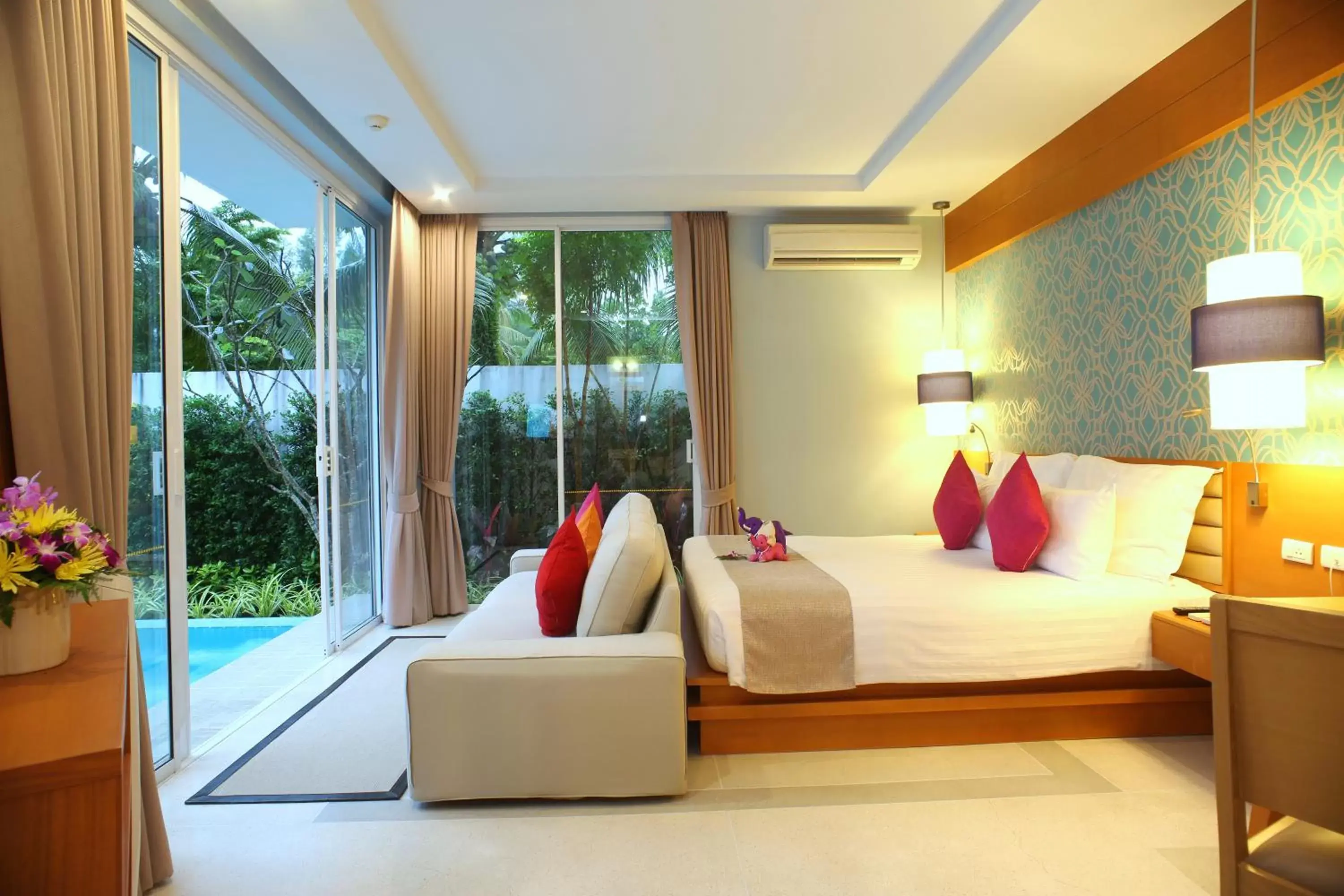 Seating area, Bed in Apsara Beachfront Resort & Villa - SHA Extra Plus Seating area, Bed in Apsara Beachfront Resort & Villa - SHA Extra Plus