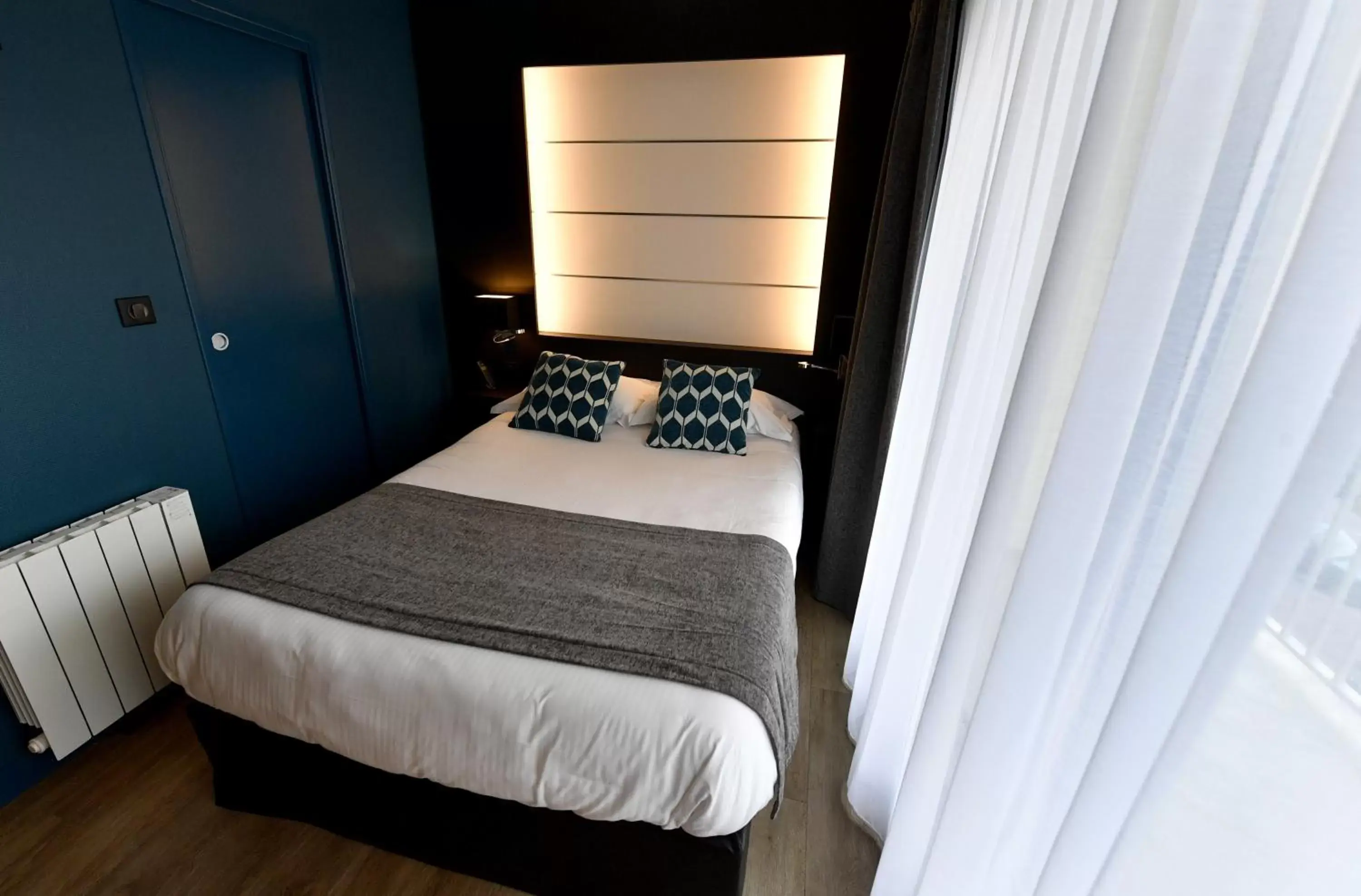 Bed in Hôtel Des Quatrans