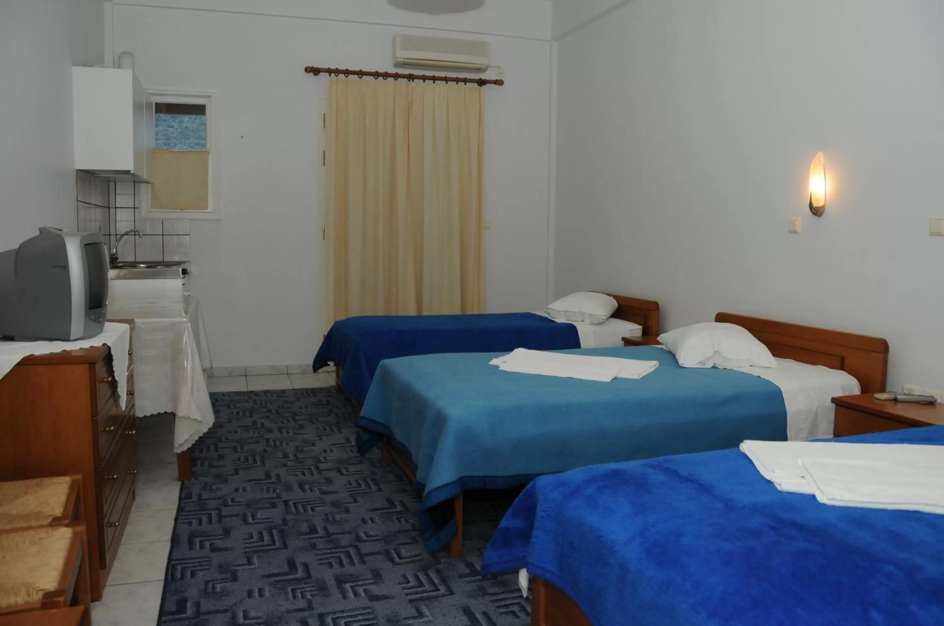 Bedroom in Costa-Rini Hotel