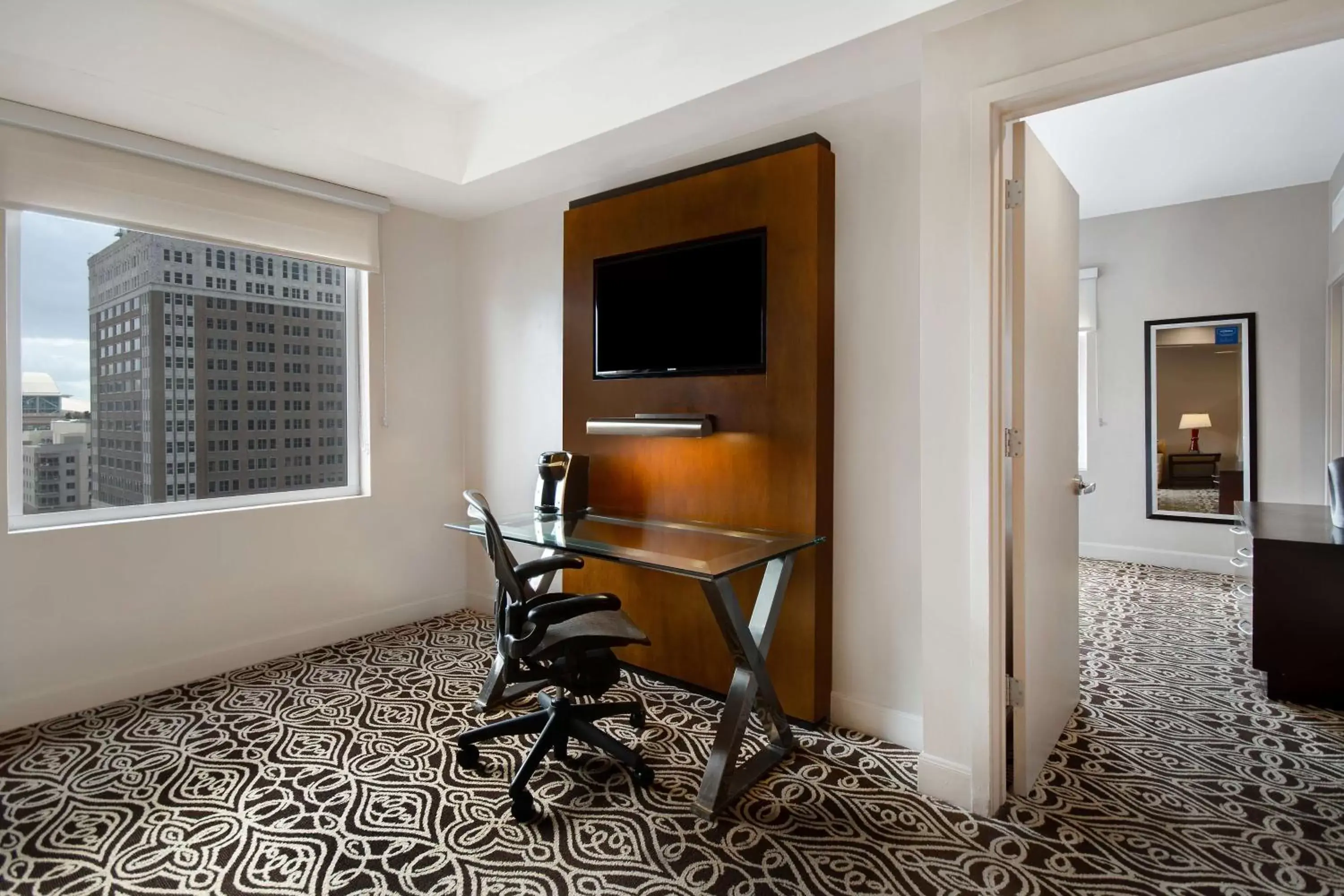 Bedroom, TV/Entertainment Center in The Sam Houston Hotel, Curio Collection by Hilton