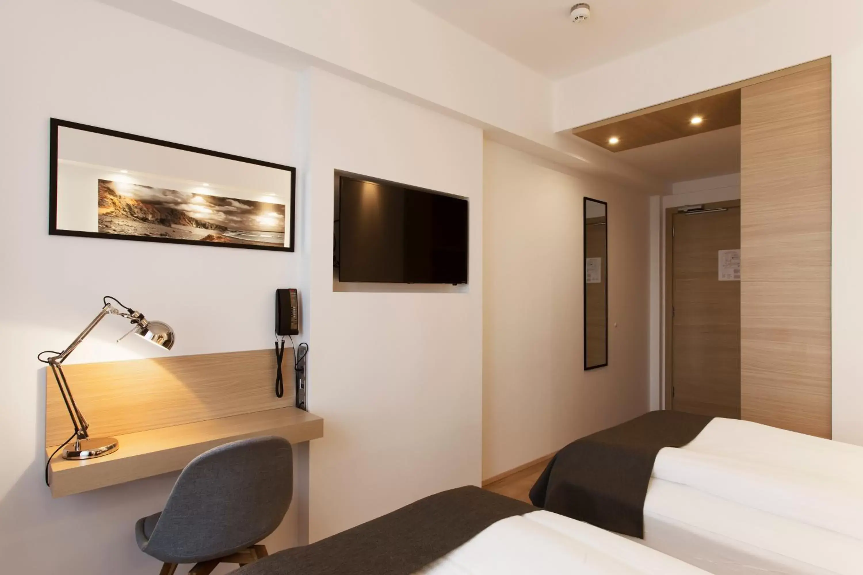 Bedroom, TV/Entertainment Center in Storm Hotel by Keahotels