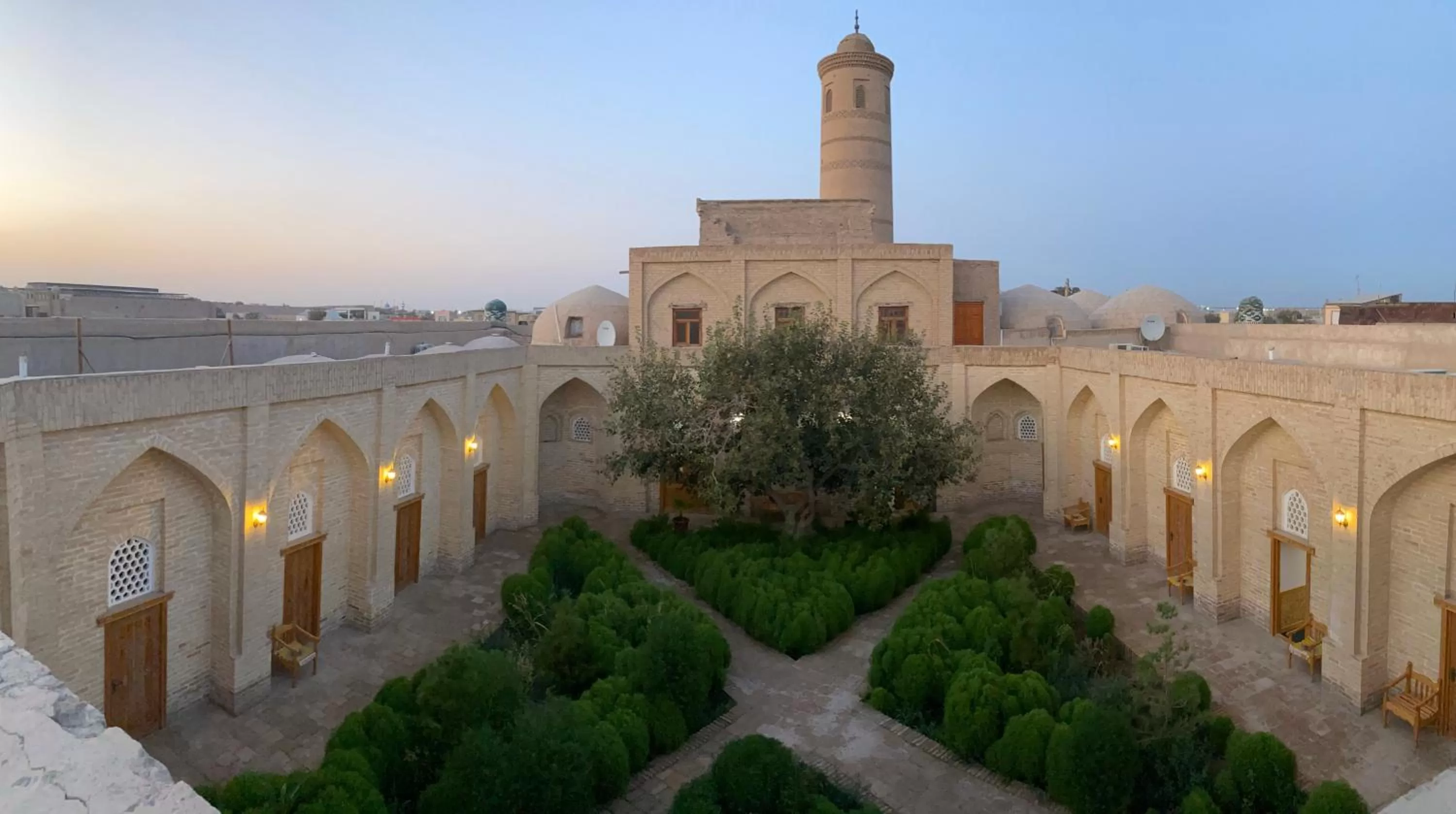 Inner courtyard view in madrasah Polvon-Qori boutique hotel XIX century