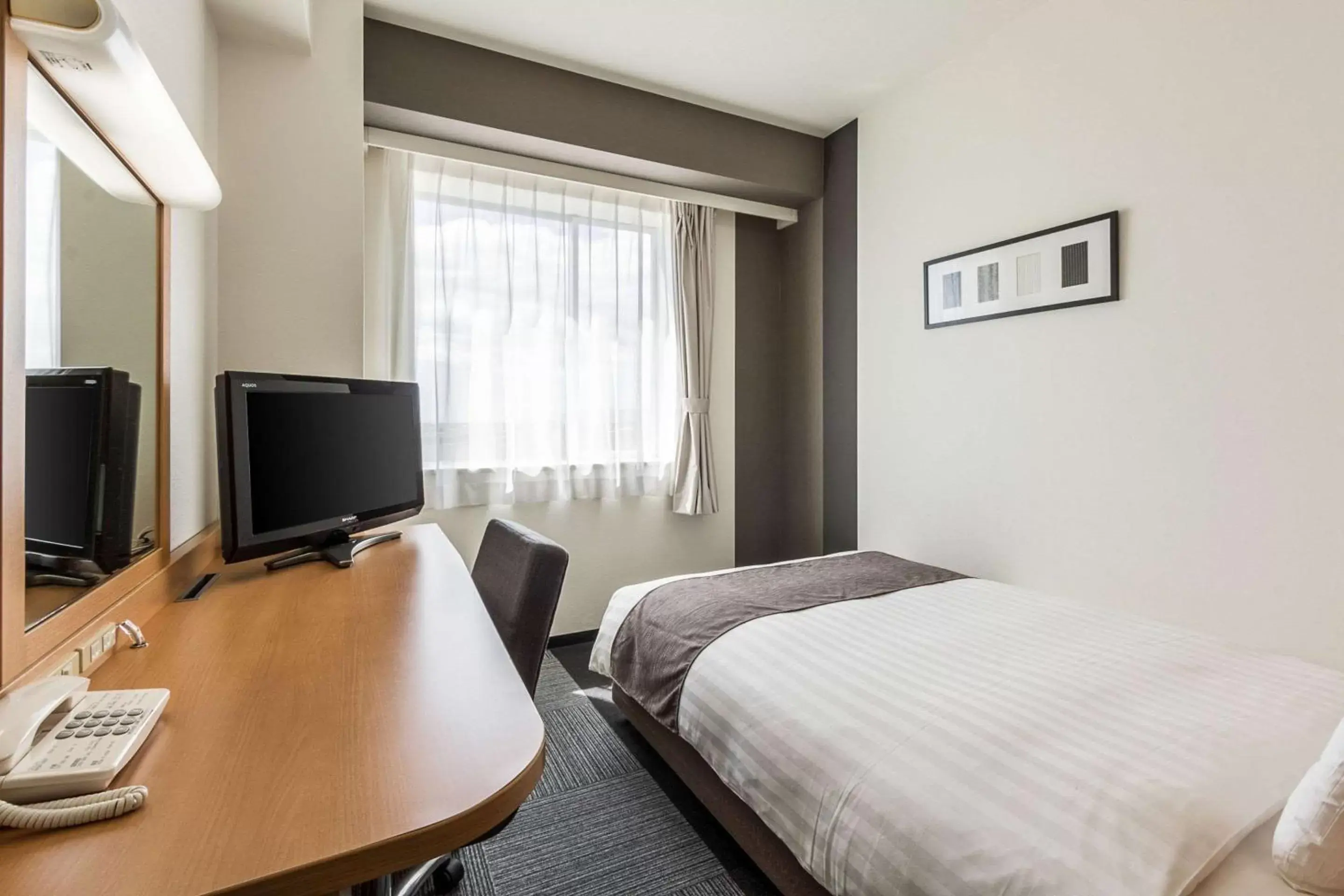 Photo of the whole room, TV/Entertainment Center in Comfort Hotel Gifu