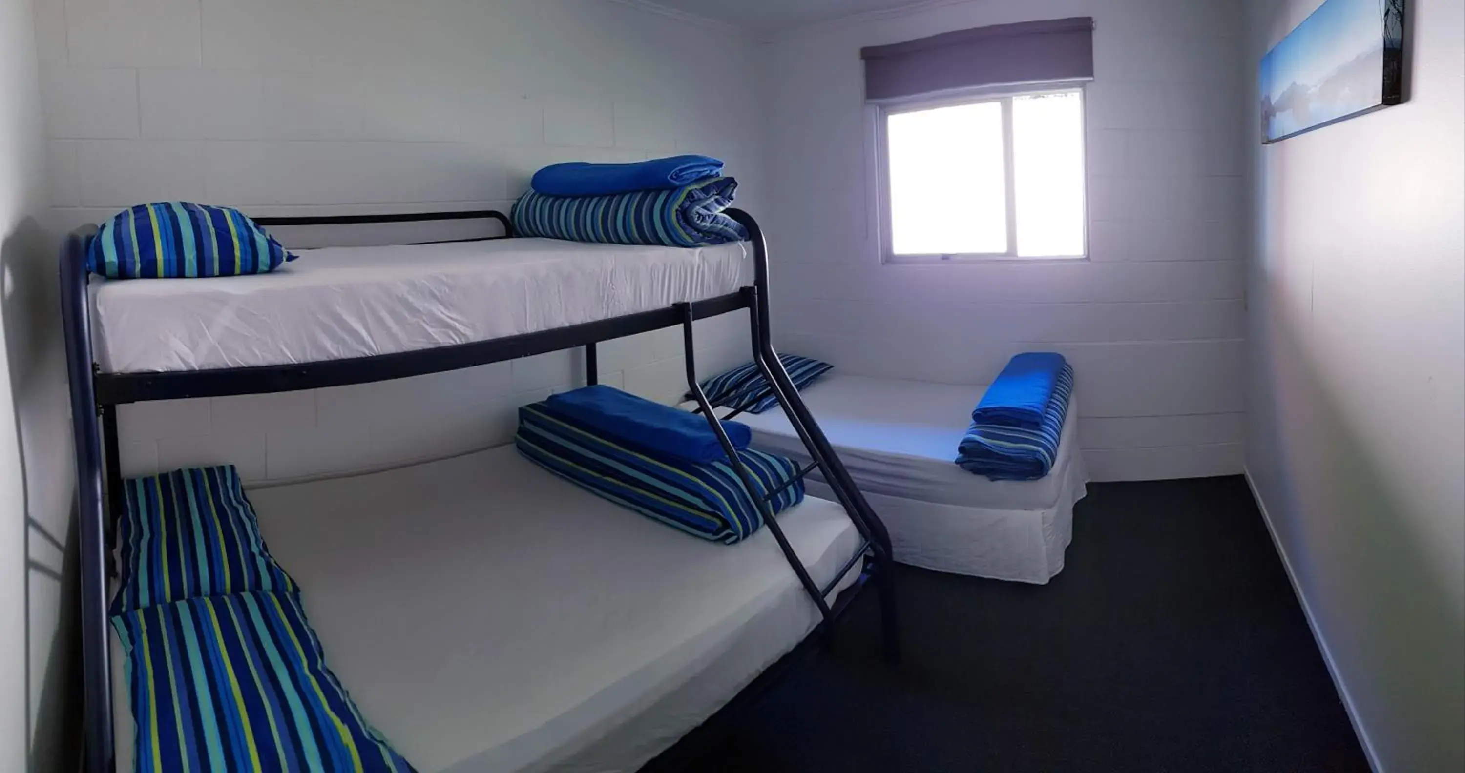 Economy Quadruple Room with Shared Bathroom in Happy Apple Backpackers